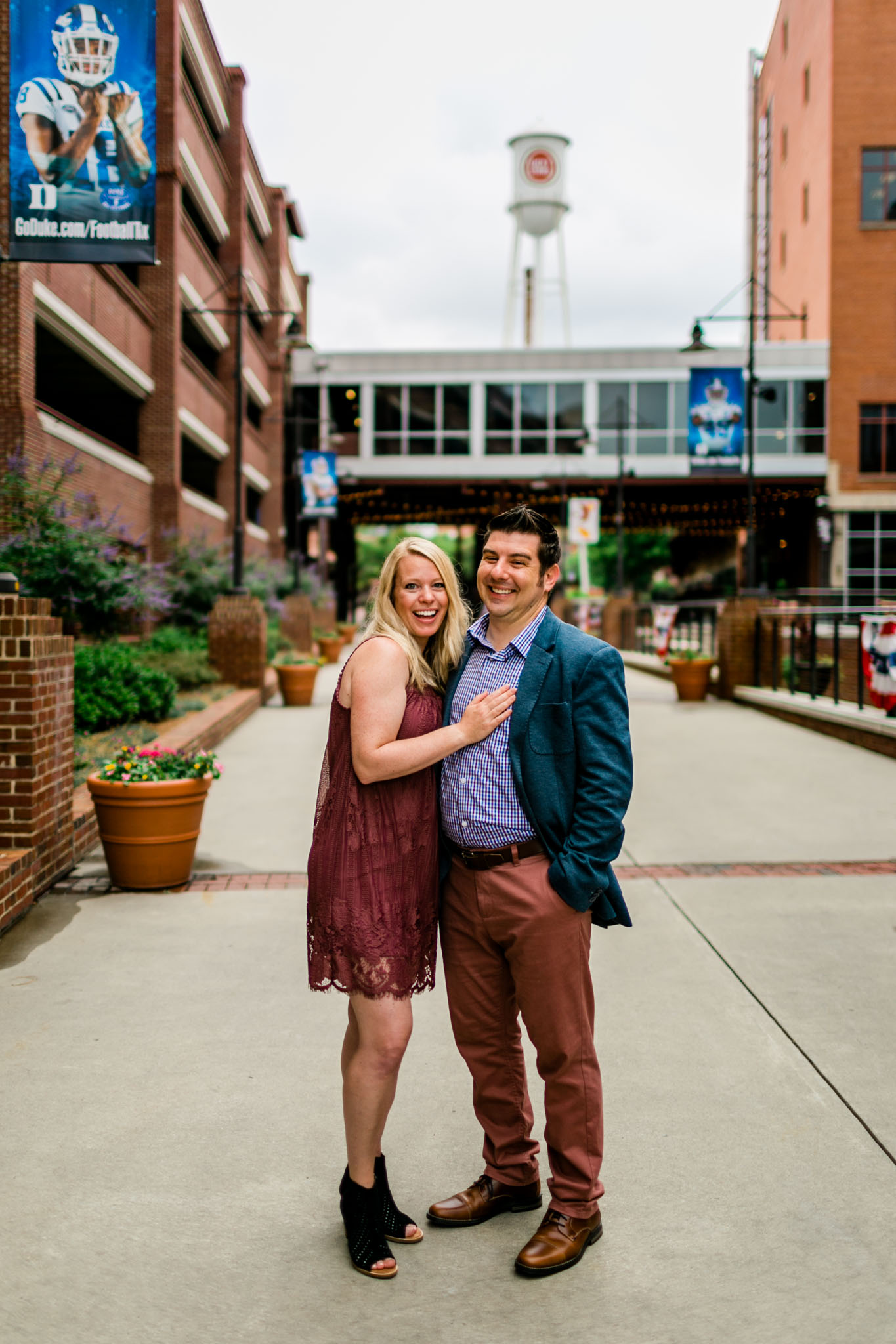 Durham Family Photographer | By G. Lin Photography | Portrait of couple smiling at camera at American Tobacco Campus