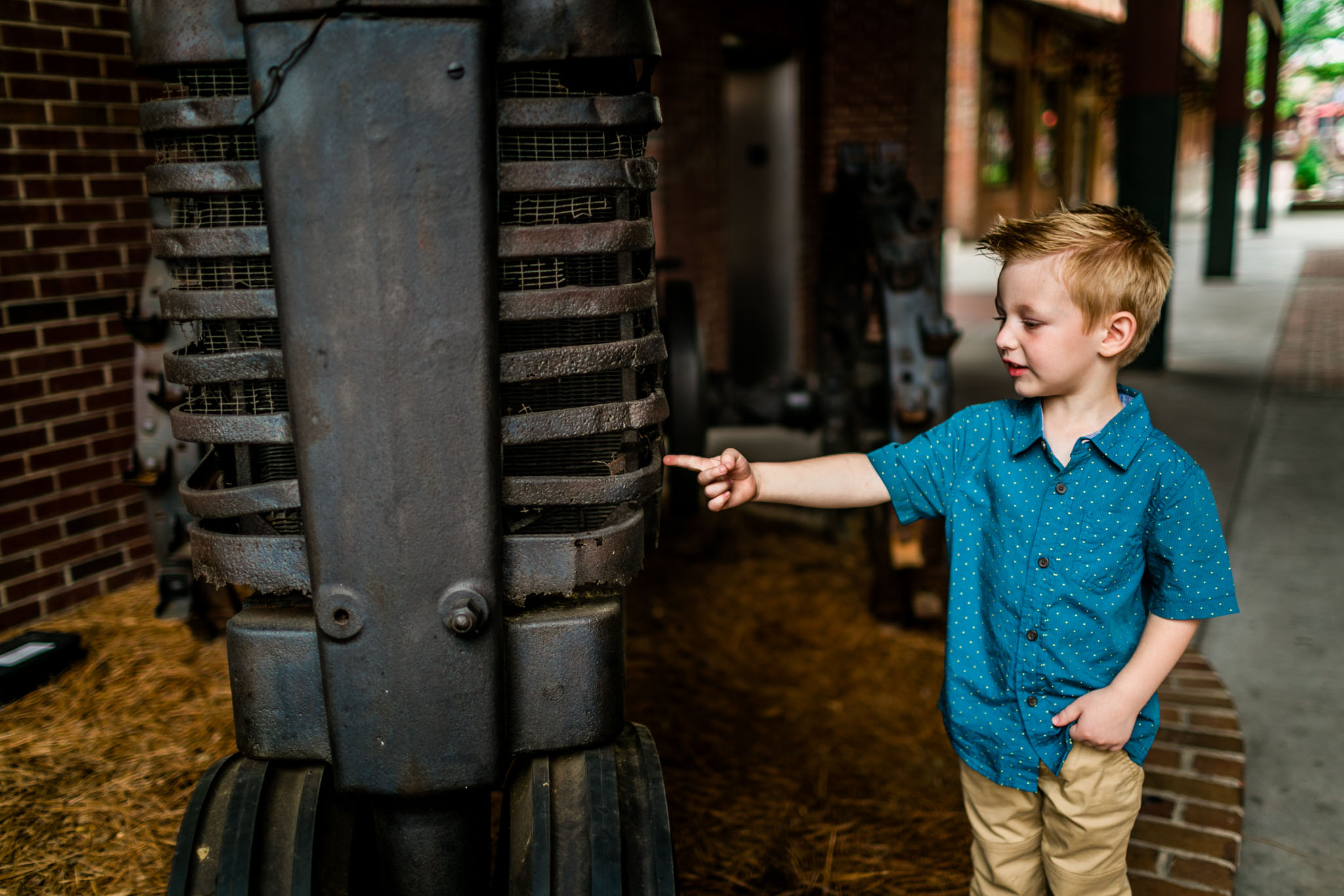 Durham Photographer | By G. Lin Photography | Young buy pointing at tractor