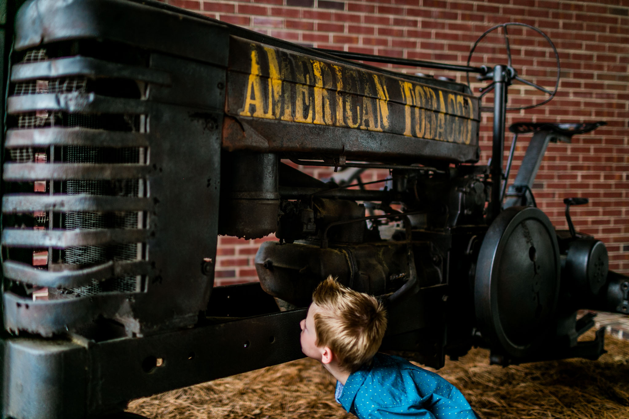 Durham Photographer | By G. Lin Photography | Young buy inspecting tractor