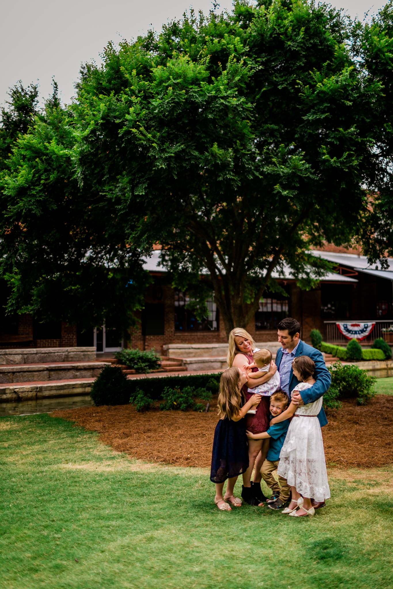 Durham Family Photographer | By G. Lin Photography | Candid portrait of family hugging together