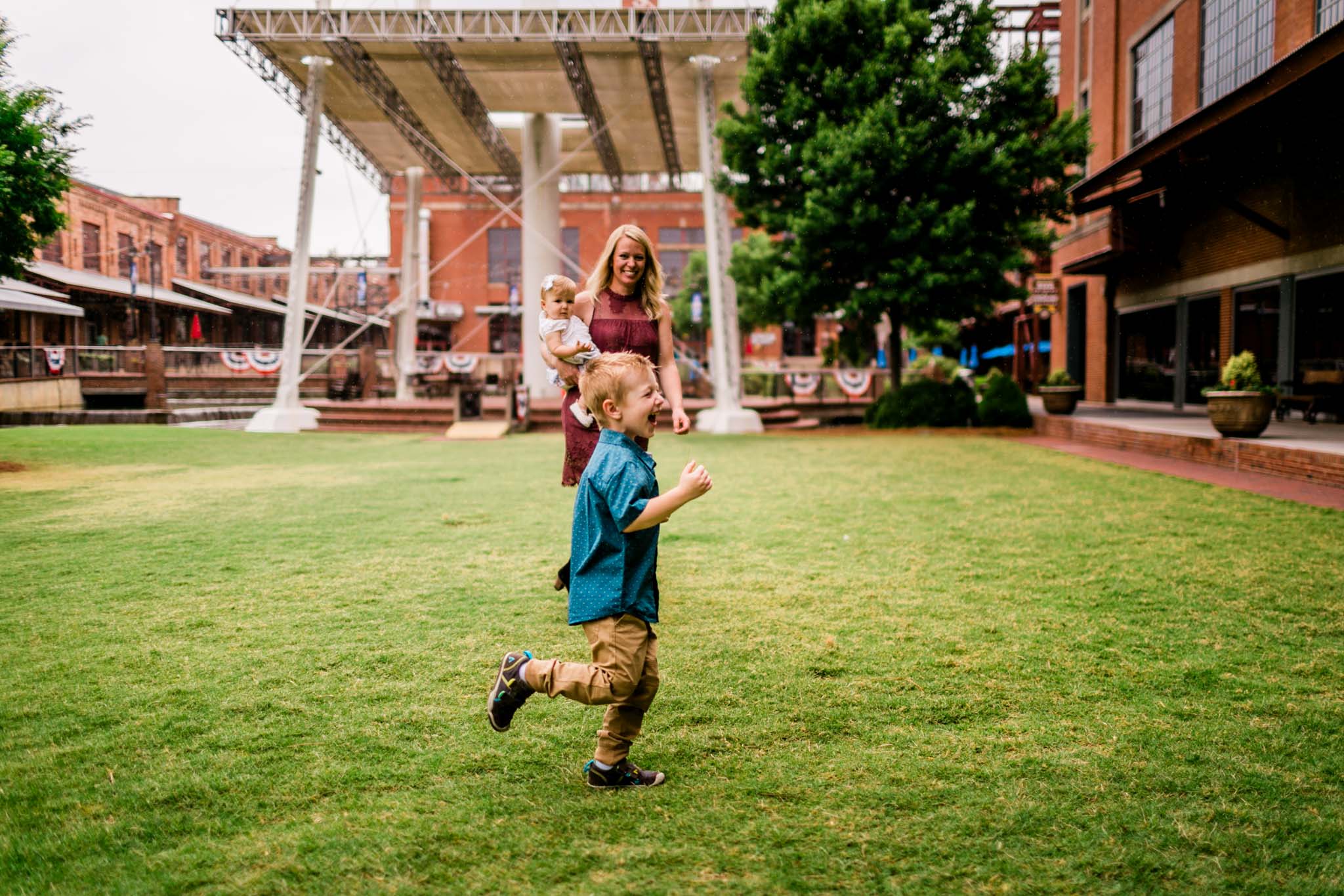 Durham Family Photographer | By G. Lin Photography | Young boy laughing and running across grass
