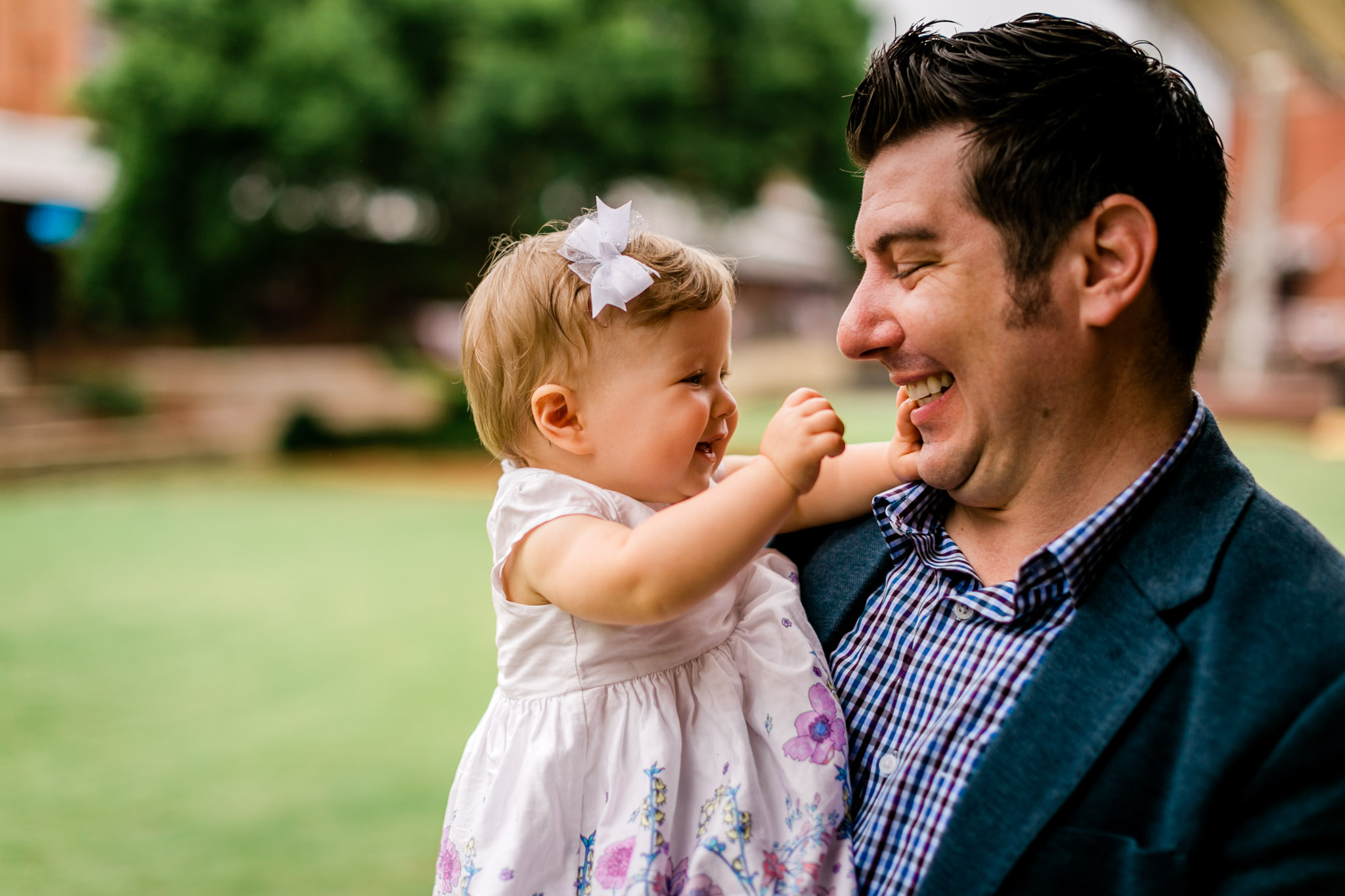 Durham Family Photographer | By G. Lin Photography | father and baby daughter playing with each other