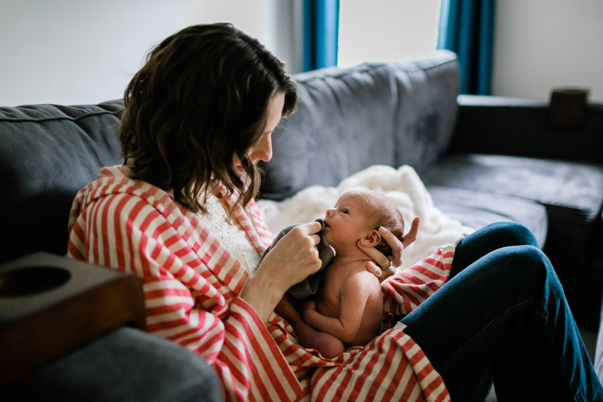 Durham Newborn Photographer | By G. Lin Photography | Mother wiping baby's mouth