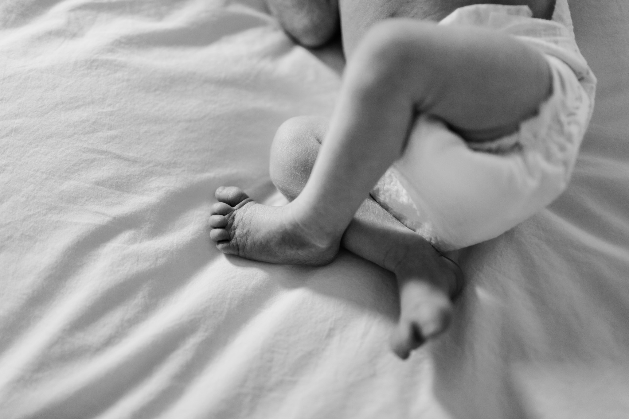 Durham Newborn Photographer | By G. Lin Photography | Black and white photo of close up of baby's feet