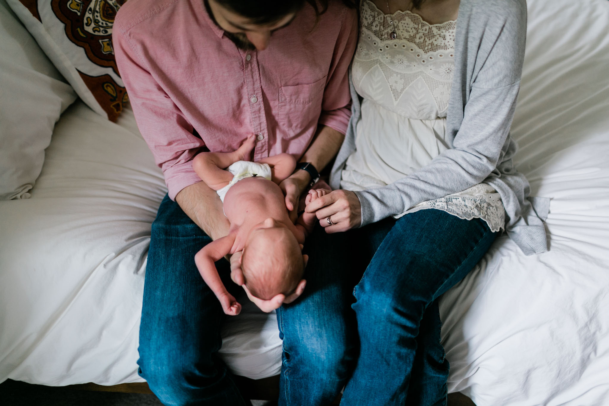 Durham Newborn Photographer | By G. Lin Photography | Parents holding baby in their hands
