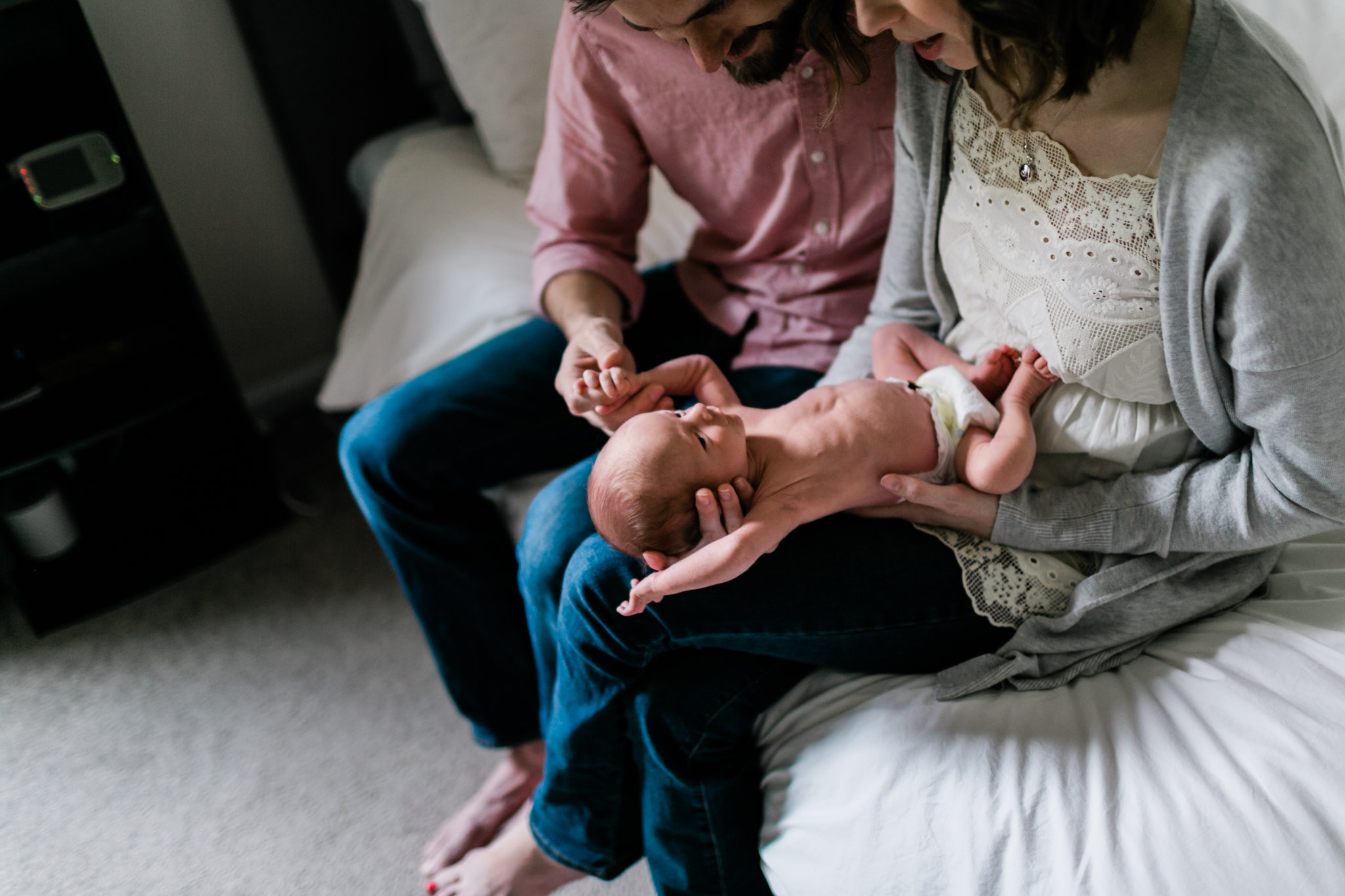 Durham Newborn Photographer | By G. Lin Photography | Beautiful natural image of mother holding baby in lap