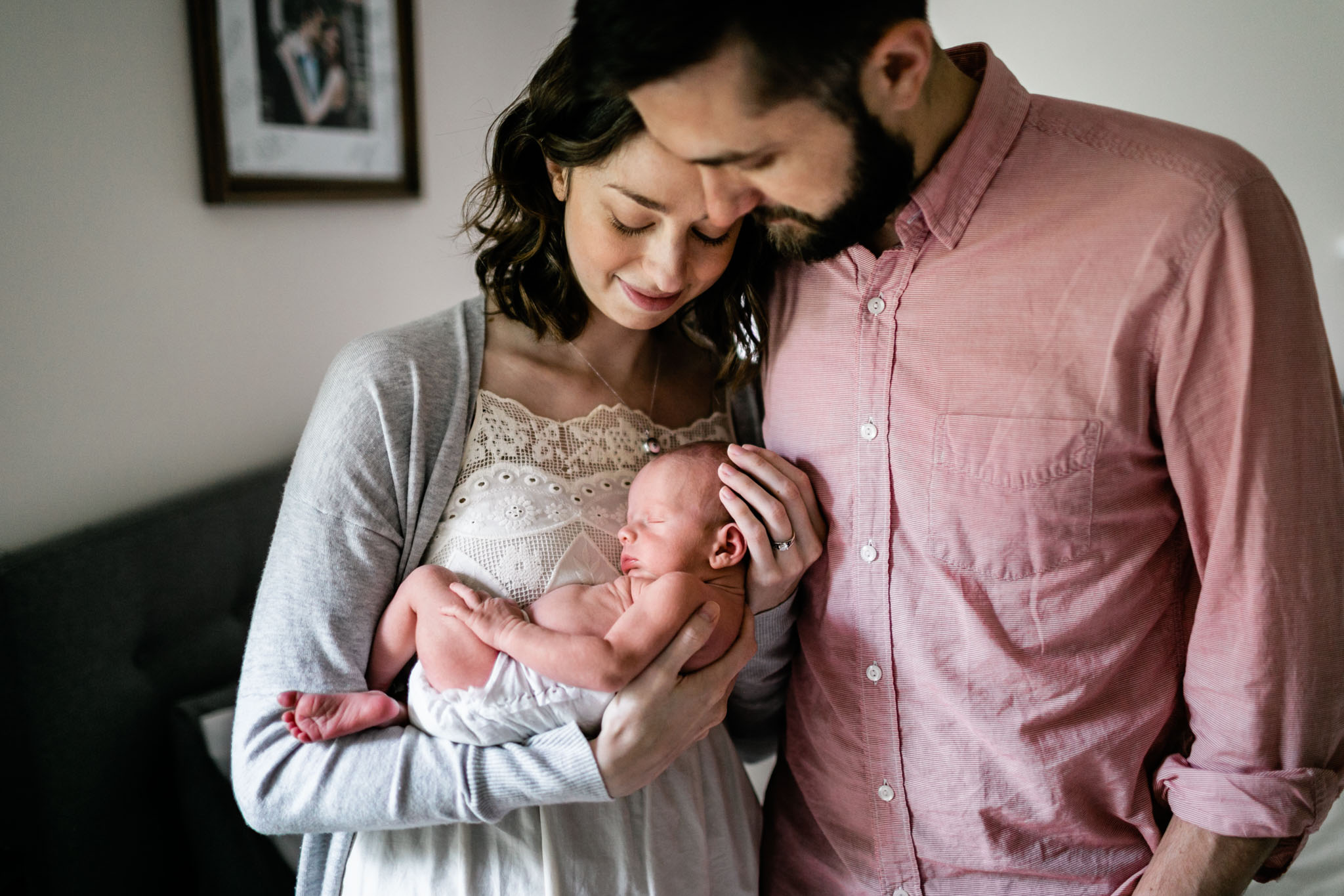Durham Newborn Photographer | By G. Lin Photography | Lifestyle Newborn photography at home with parents holding baby