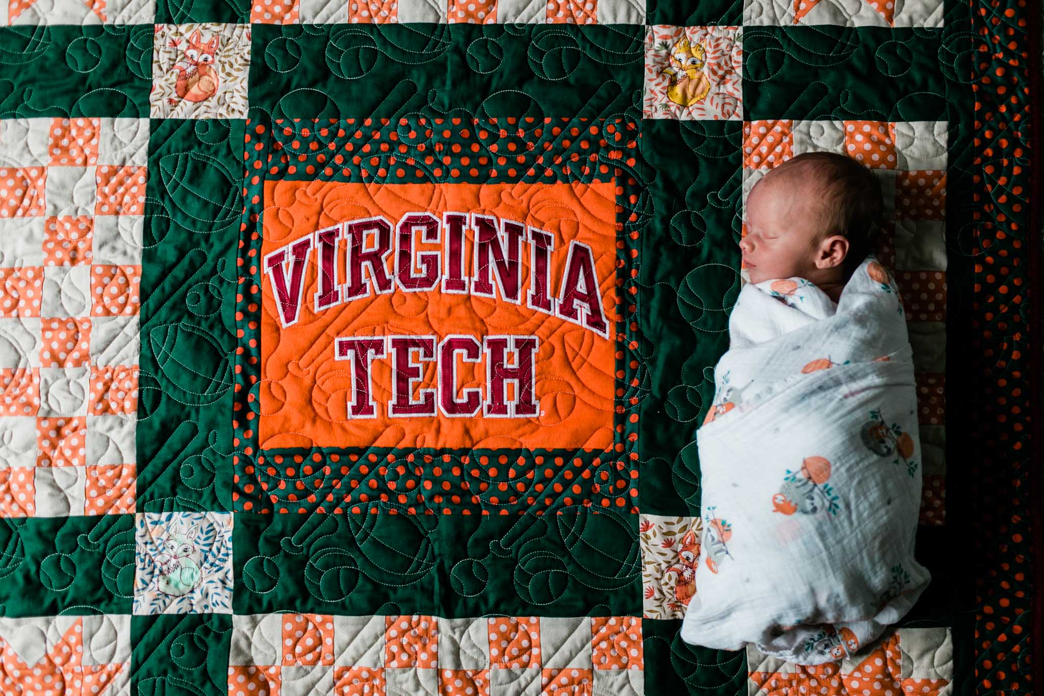 Durham Newborn Photographer | By G. Lin Photography | Baby lying on Virginia Tech blanket quilt