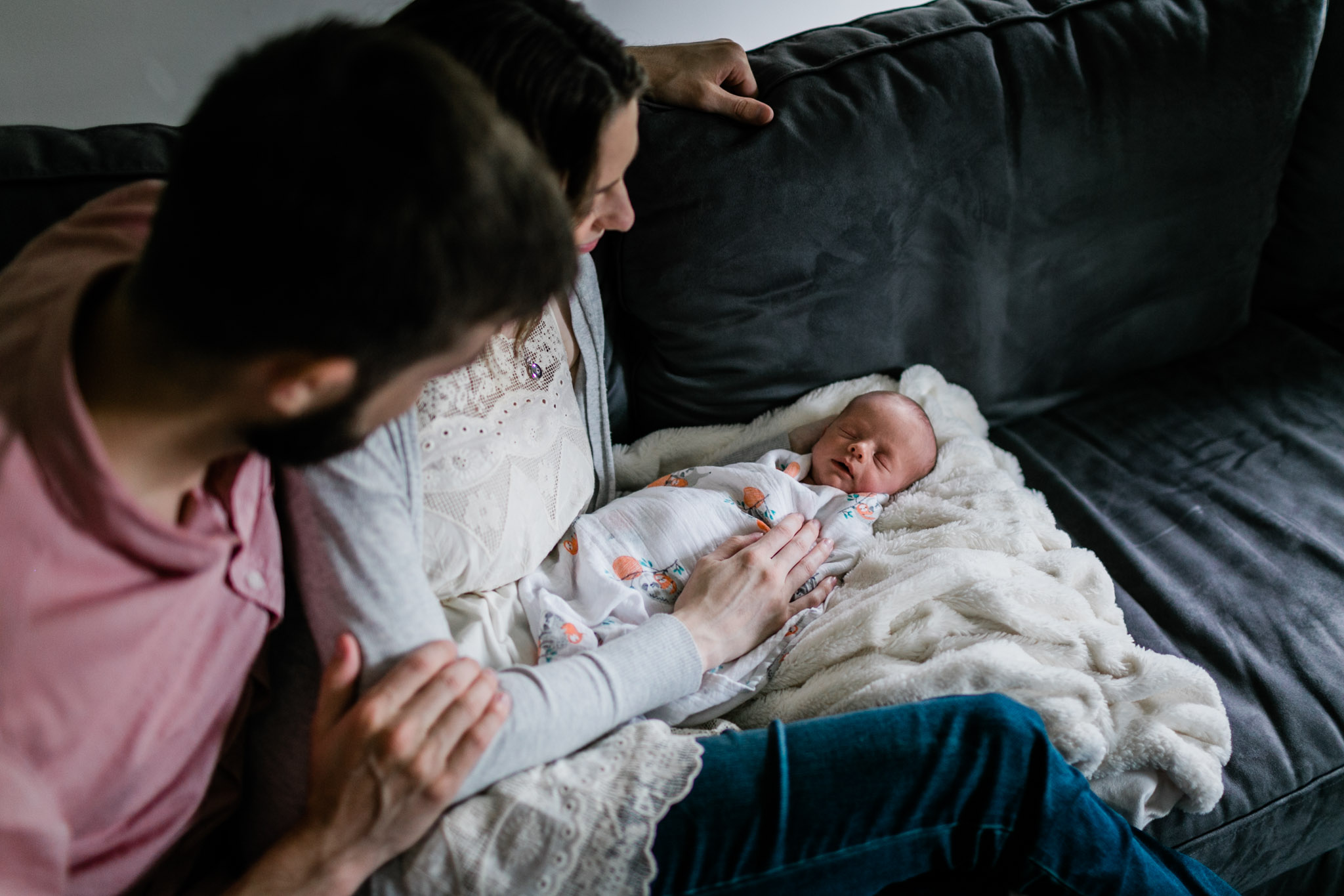 Raleigh Newborn Photographer | By G. Lin Photography | Parents looking at newborn baby and smiling