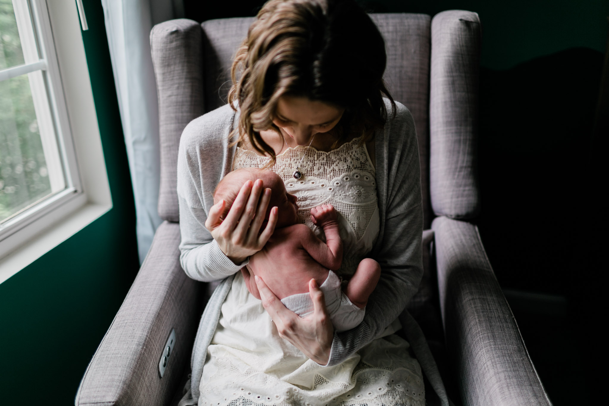 Durham Newborn Photographer | By G. Lin Photography | Mother holding baby in arms