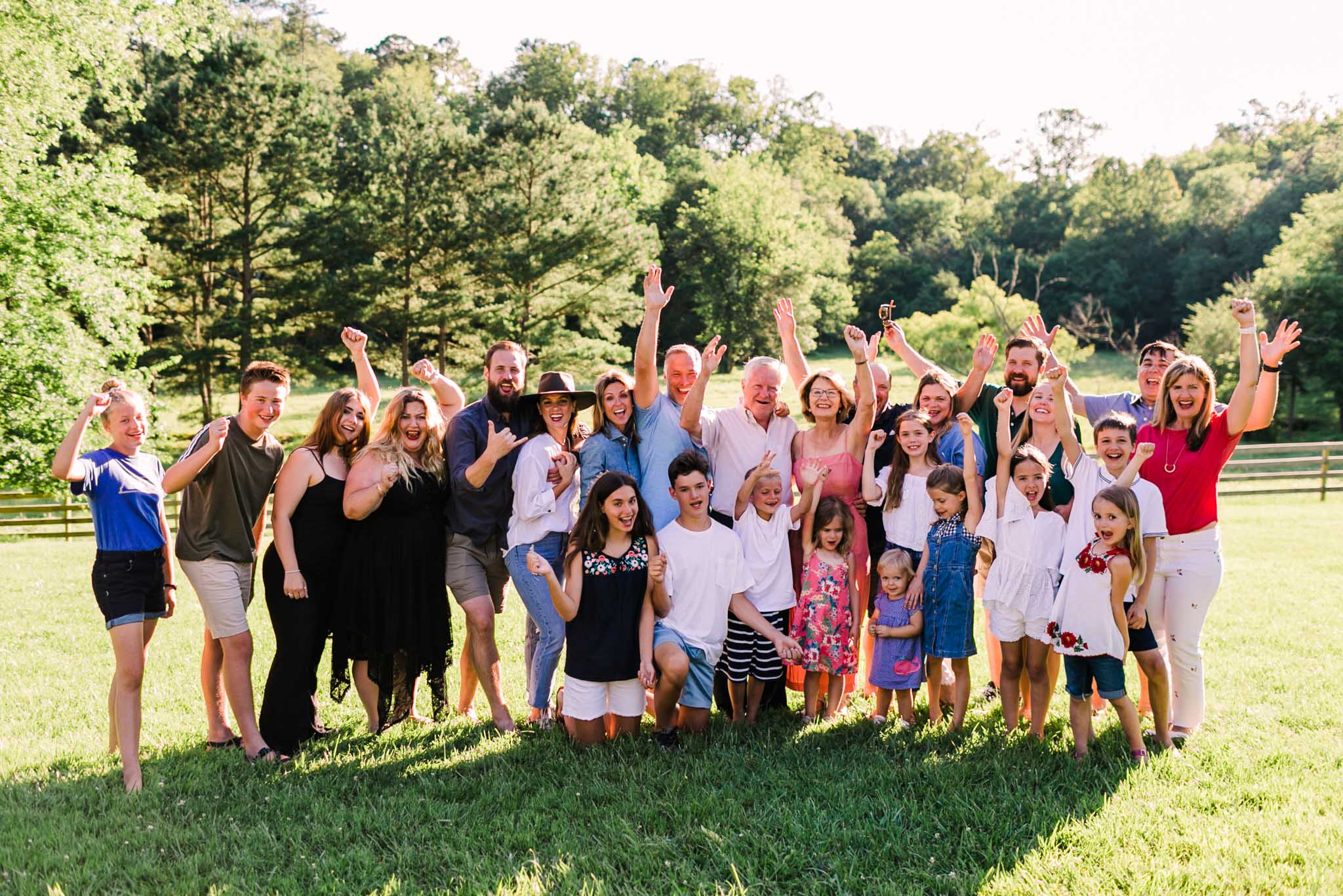 Durham Family Photographer | By G. Lin Photography | Group photo of people smiling and cheering outside