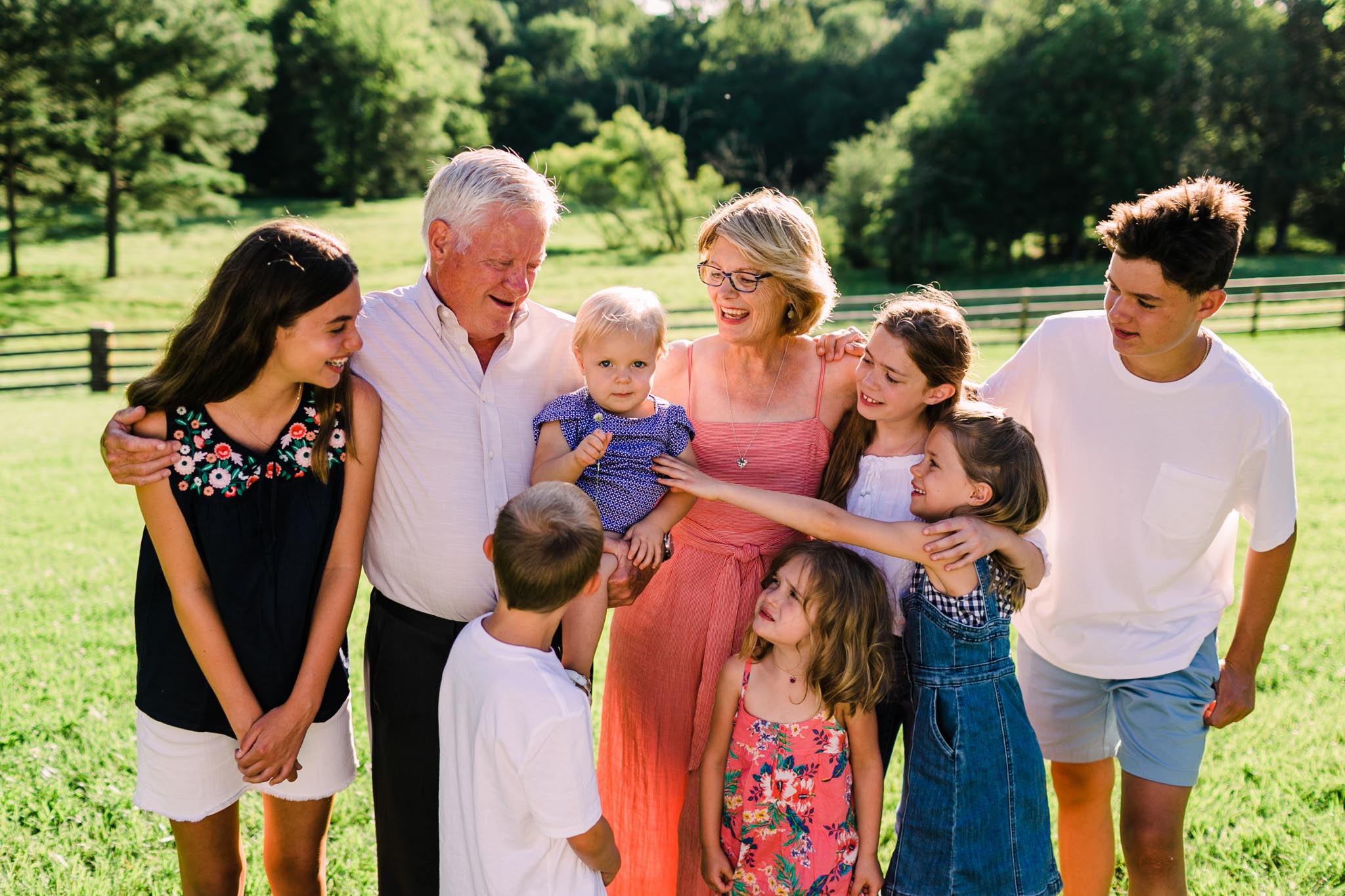 Durham Family Photographer | By G. Lin Photography | Candid portrait of grandparents holding grandkids outside