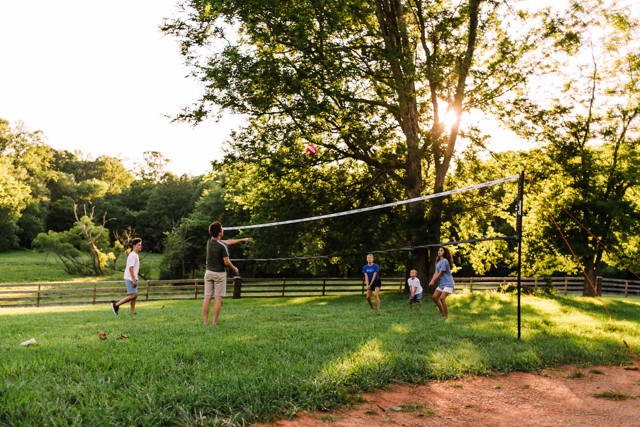 Durham Family Photographer | By G. Lin Photography | Teenage kids playing volleyball outdoors