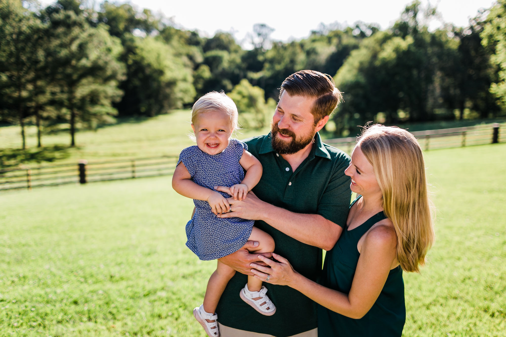 Durham Family Photographer | By G. Lin Photography | Mom and dad holding baby girl outside