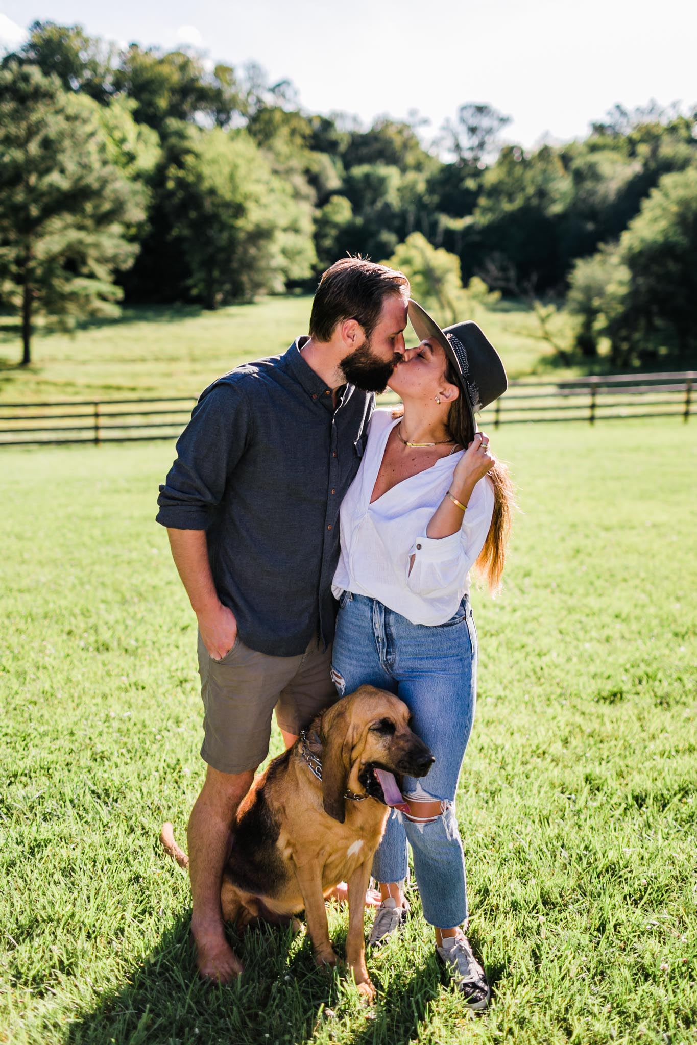 Durham Family Photographer | By G. Lin Photography | Couple kissing outdoors in open field