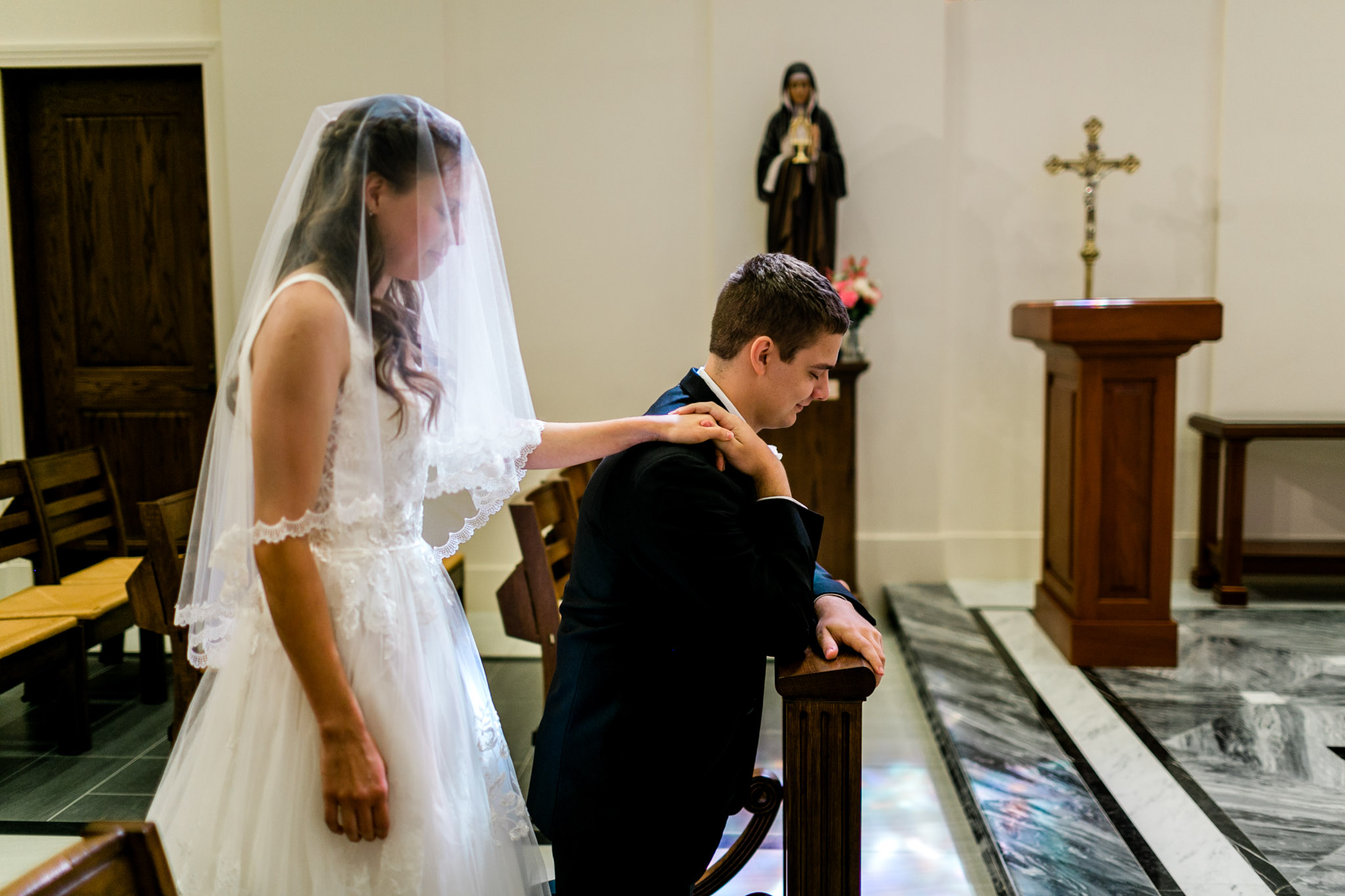 Bride and Groom praying in chapel at Holy Name of Jesus Cathedral | Raleigh Wedding Photographer | By G. Lin Photography