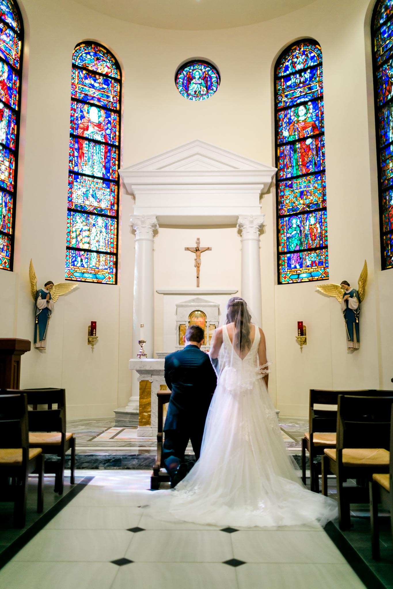 Bride and Groom praying in chapel at Holy Name of Jesus Cathedral | Raleigh Wedding Photographer | By G. Lin Photography