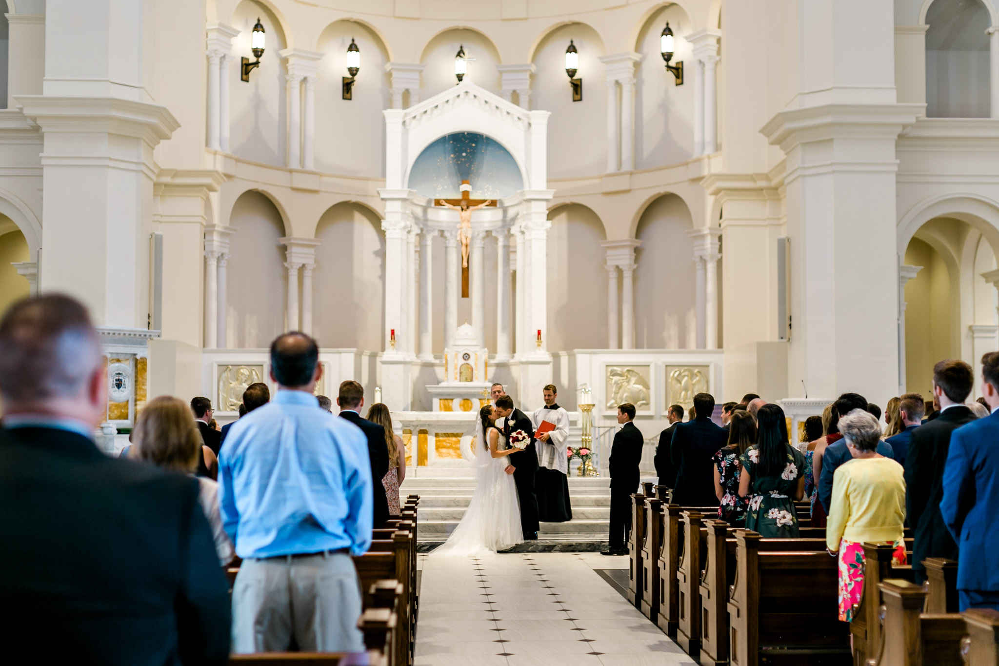 Bride and groom kiss | Holy Name of Jesus Cathedral | Raleigh Wedding Photographer | By G. Lin Photography