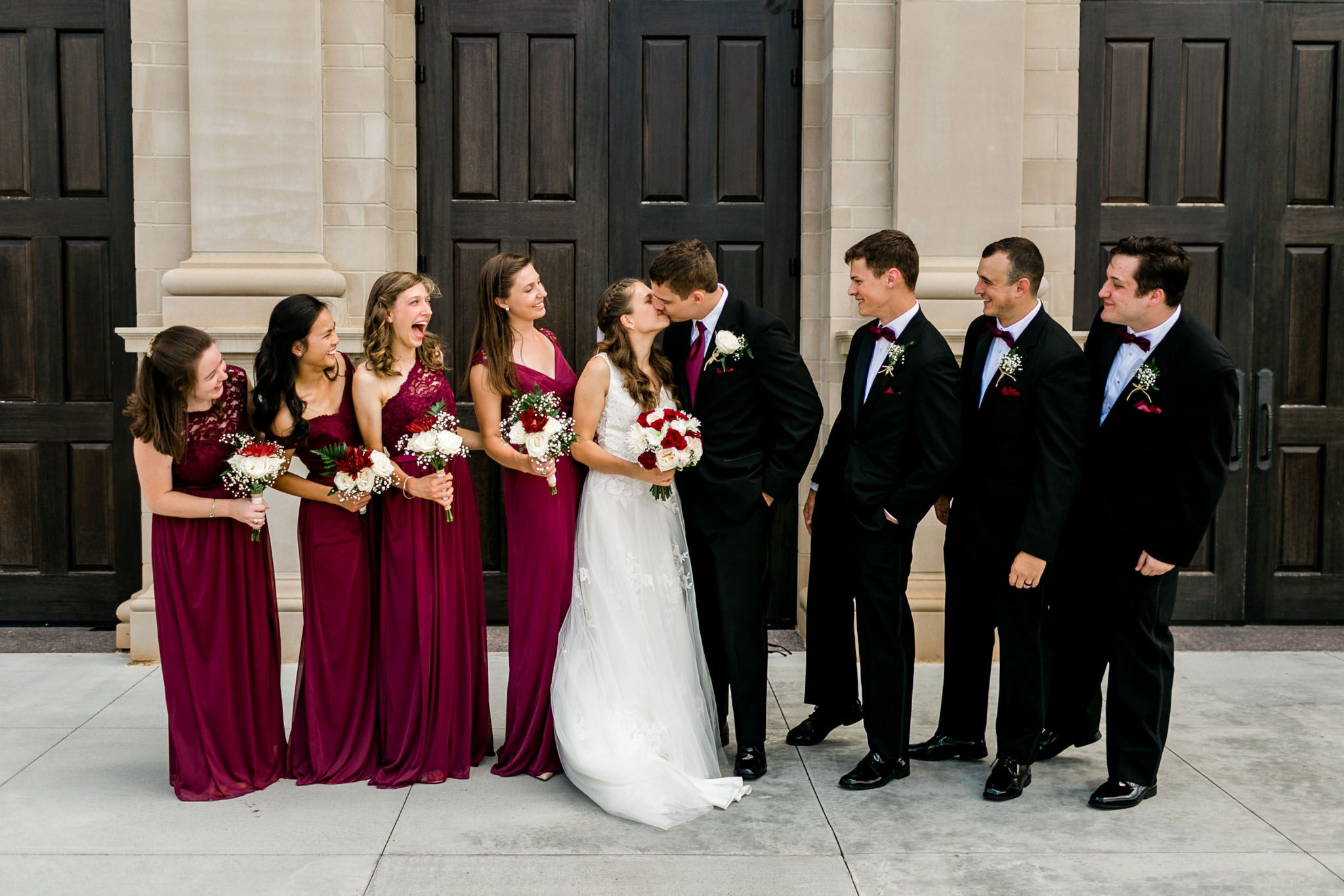 Wedding party photo with bride and groom kissing | Raleigh Wedding Photographer | By G. Lin Photography