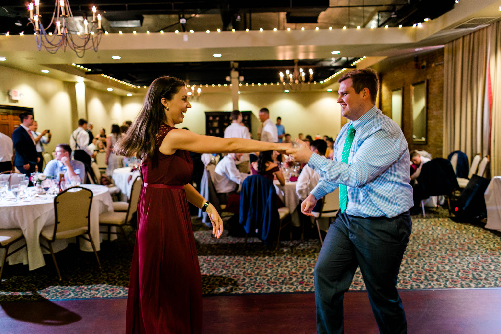 Man and woman dancing | Royal Banquet Hall |People dancing at wedding reception at Royal Banquet Conference Center | Raleigh Wedding Photographer | By G. Lin Photography