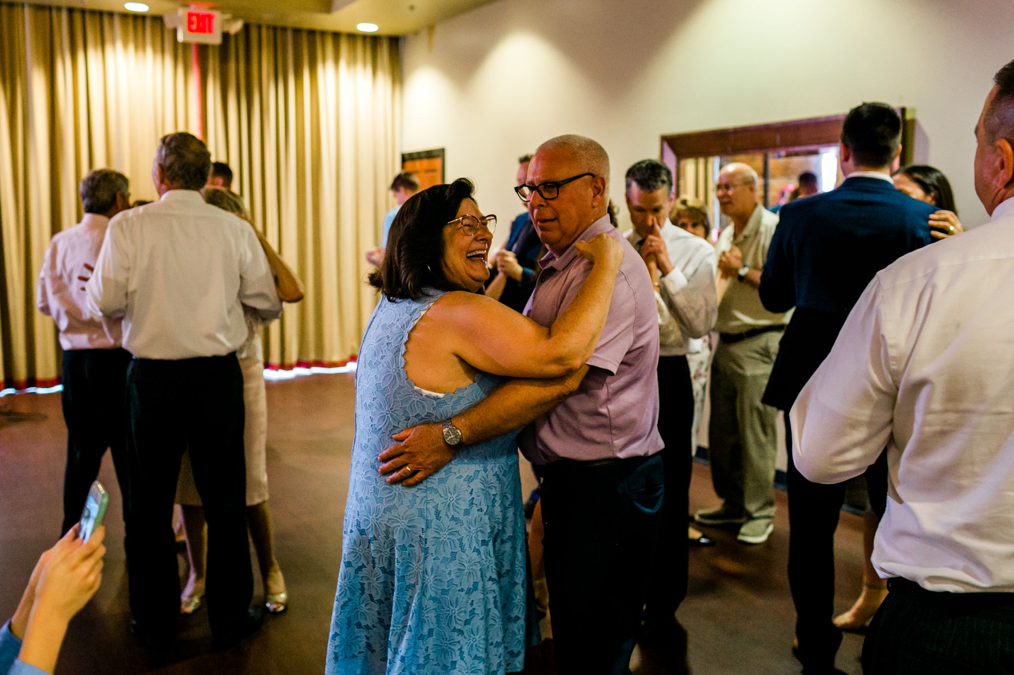 Man and woman dancing at reception | Royal Banquet Conference Center |People dancing at wedding reception at Royal Banquet Conference Center | Raleigh Wedding Photographer | By G. Lin Photography
