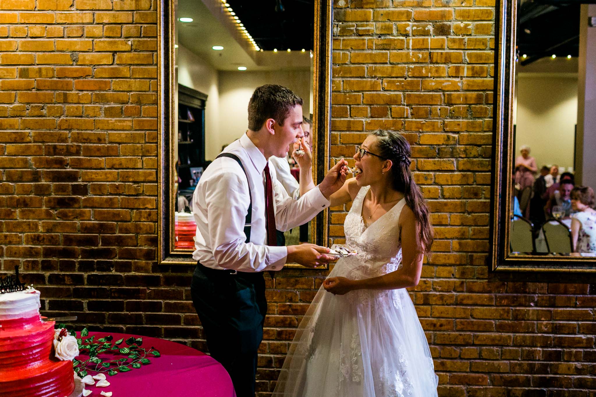 Bride and groom feeding cake to each other | Raleigh Wedding Photographer | By G. Lin Photography