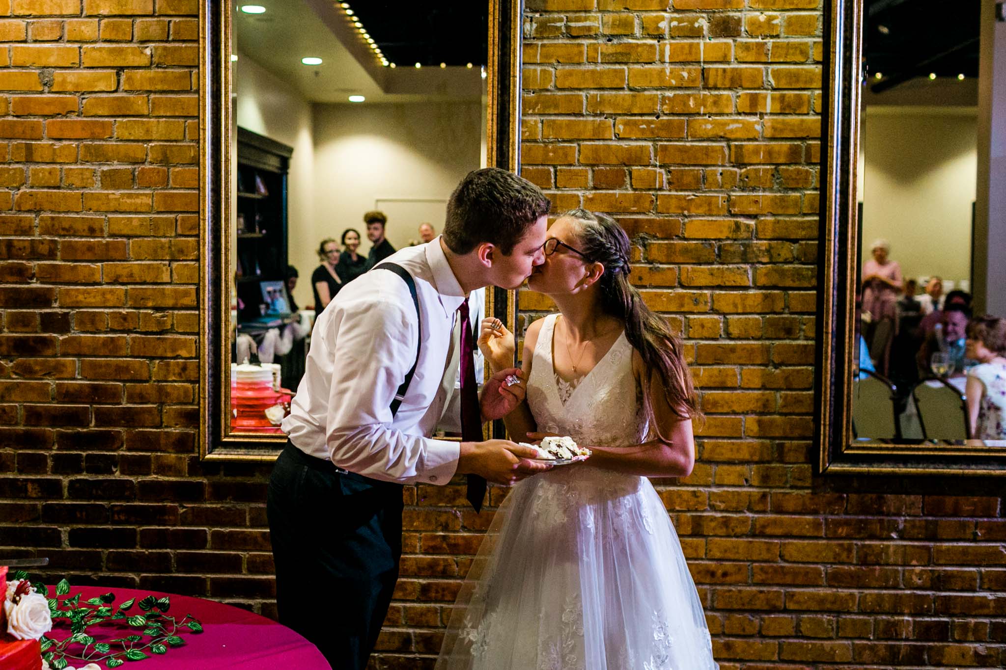 Bride and groom feeding cake to each other | Raleigh Wedding Photographer | By G. Lin Photography