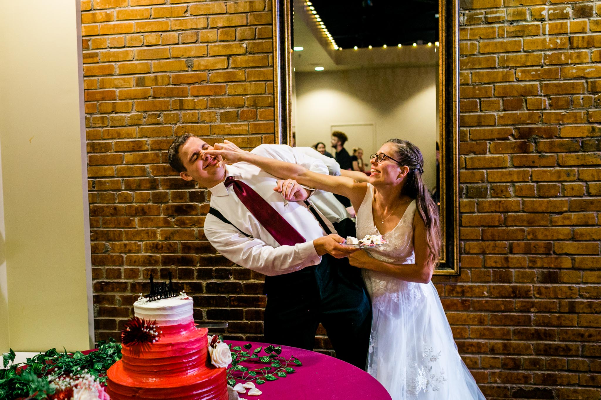 Bride and groom feeding cake to each other | Raleigh Wedding Photographer | By G. Lin Photography