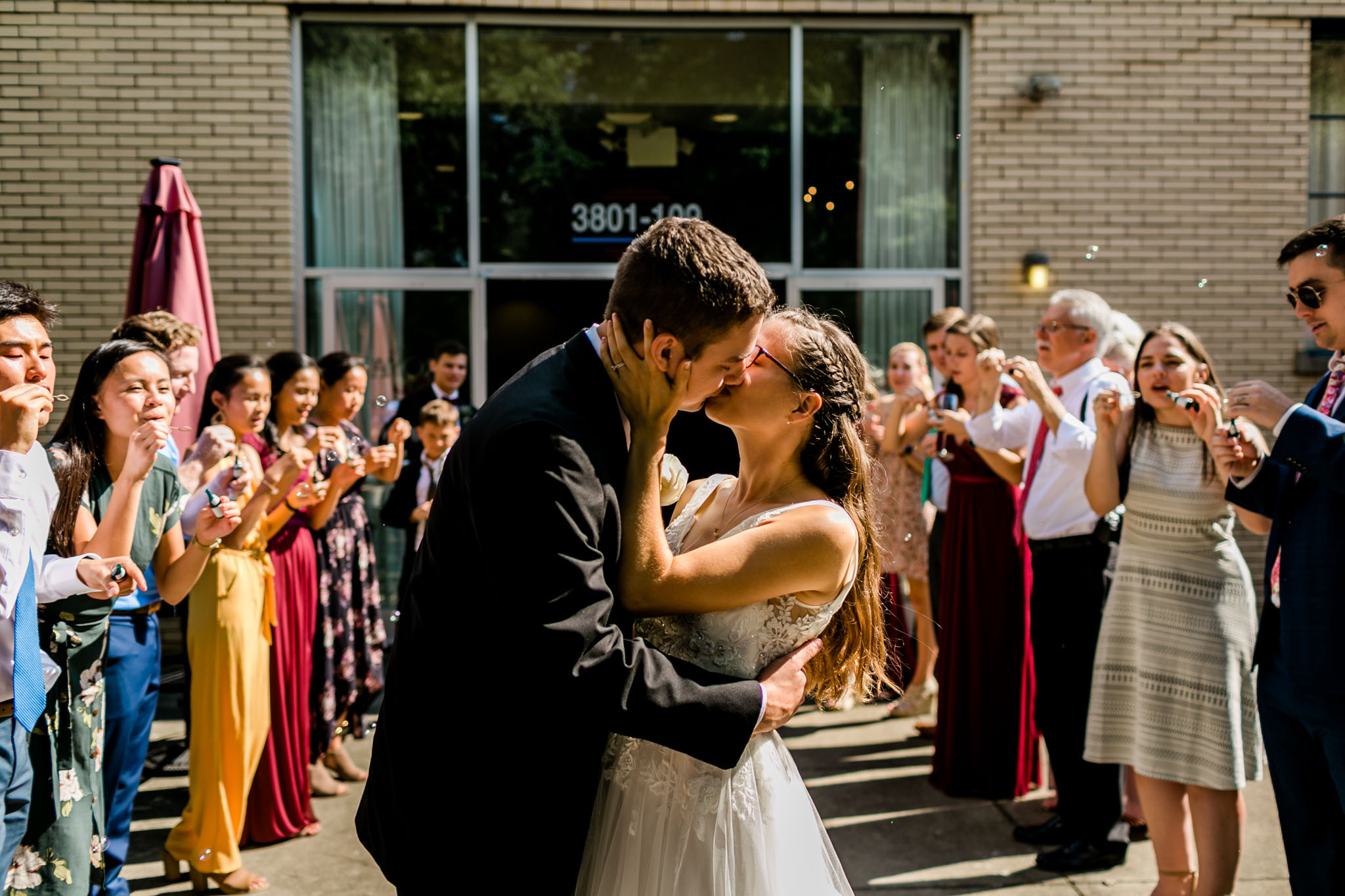 Sendoff kiss of bride and groom | Royal Banquet Conference Center | Raleigh Wedding Photographer | By G. Lin Photography