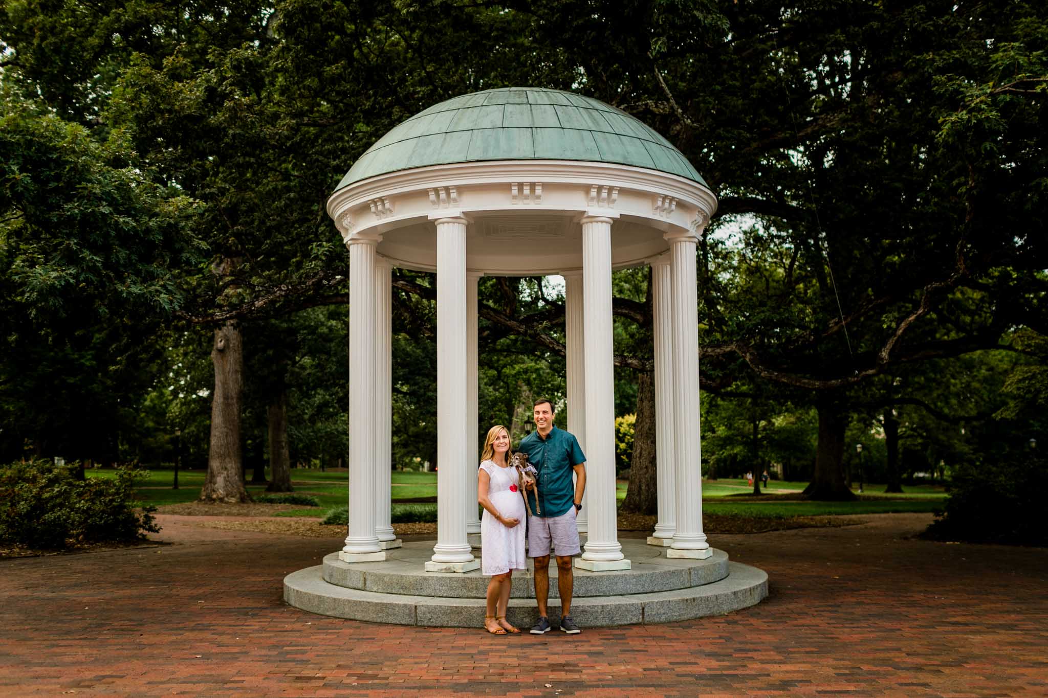 UNC Chapel Hill Maternity Photography | By G. Lin Photography | Couple standing by the Old Well