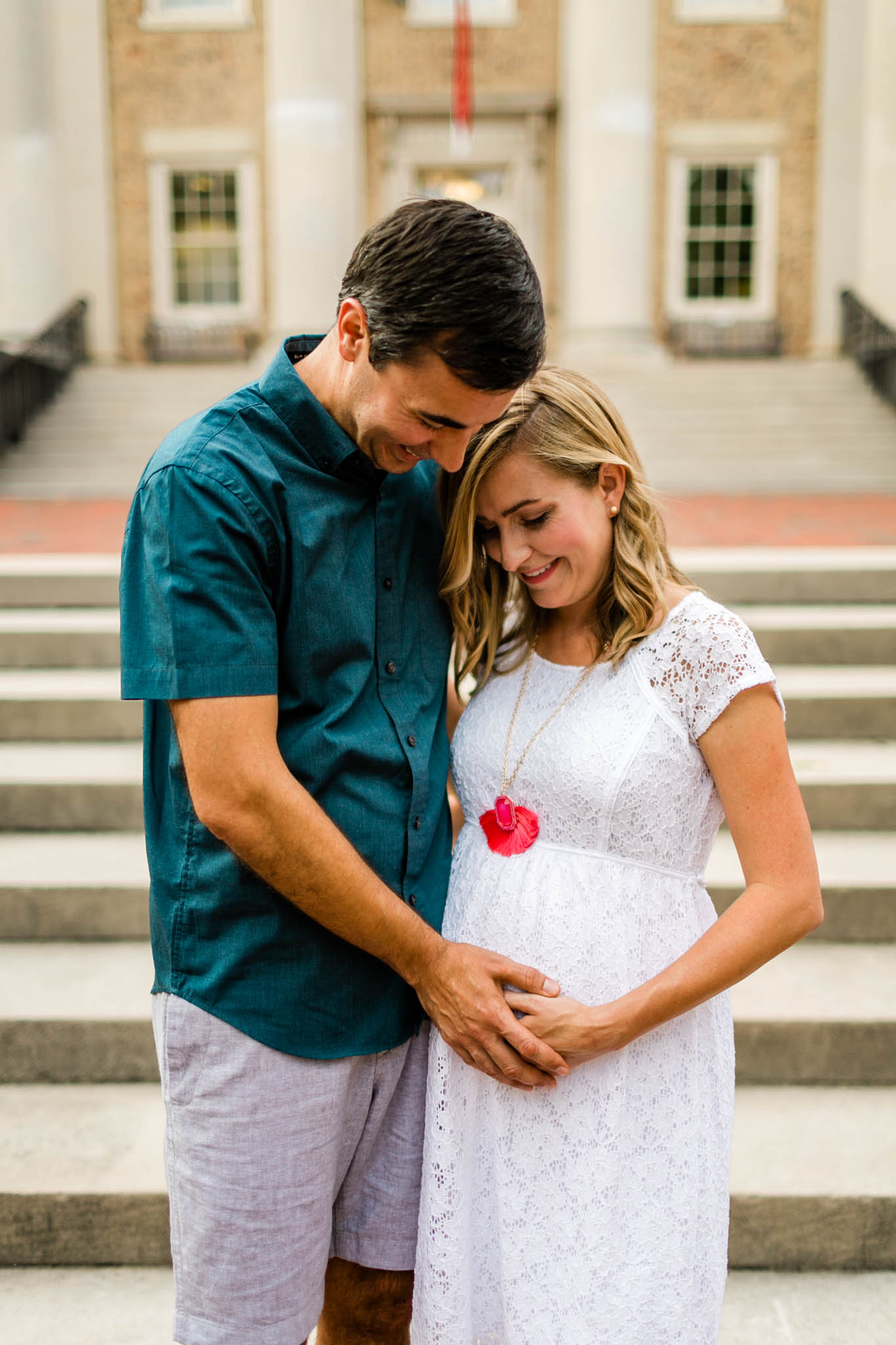UNC Maternity Photographer in Chapel Hill | By G. Lin Photography | Portrait of couple with hands on baby belly