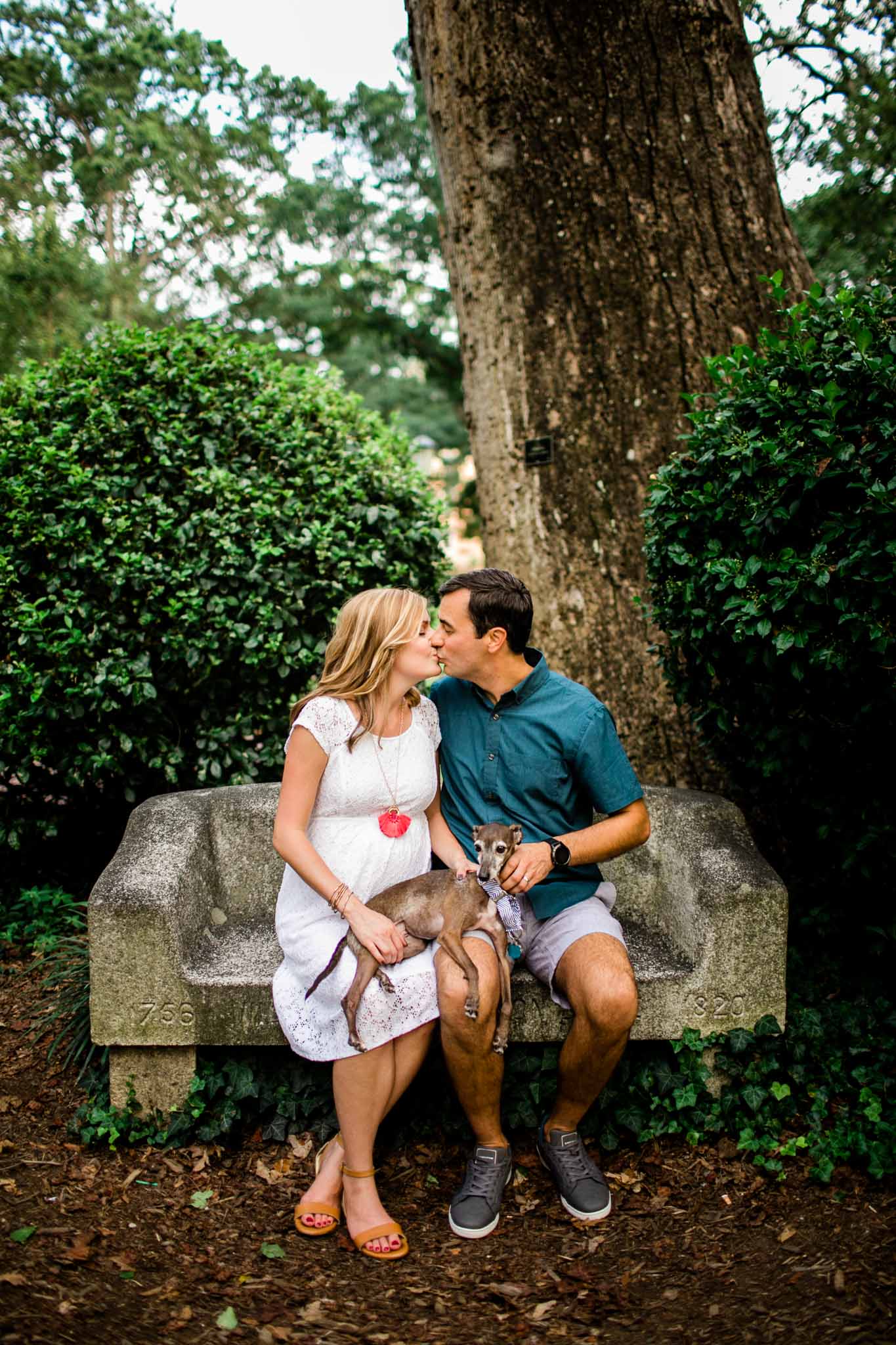 Davie Bench at UNC | By G. Lin Photography | Couple kissing on Davie Bench at UNC