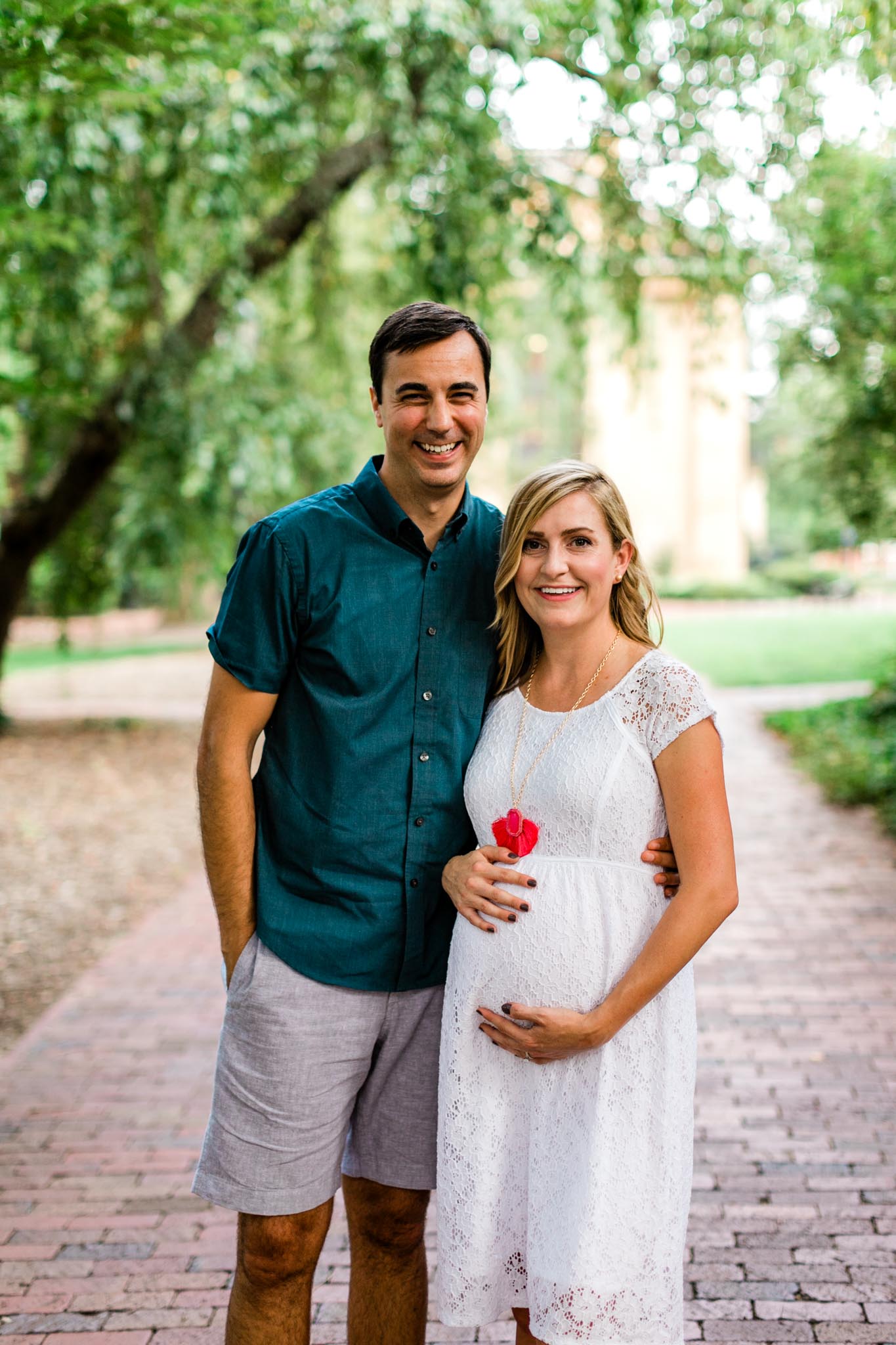 Maternity portrait of couple at McCorkle Place at UNC | By G. Lin Photography | Chapel Hill Maternity Photographer