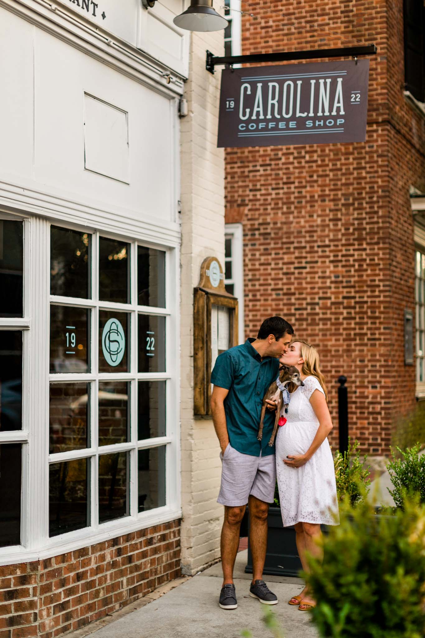 Couple standing in front of coffee shop at UNC | Chapel Hill Photographer | By G. Lin Photography