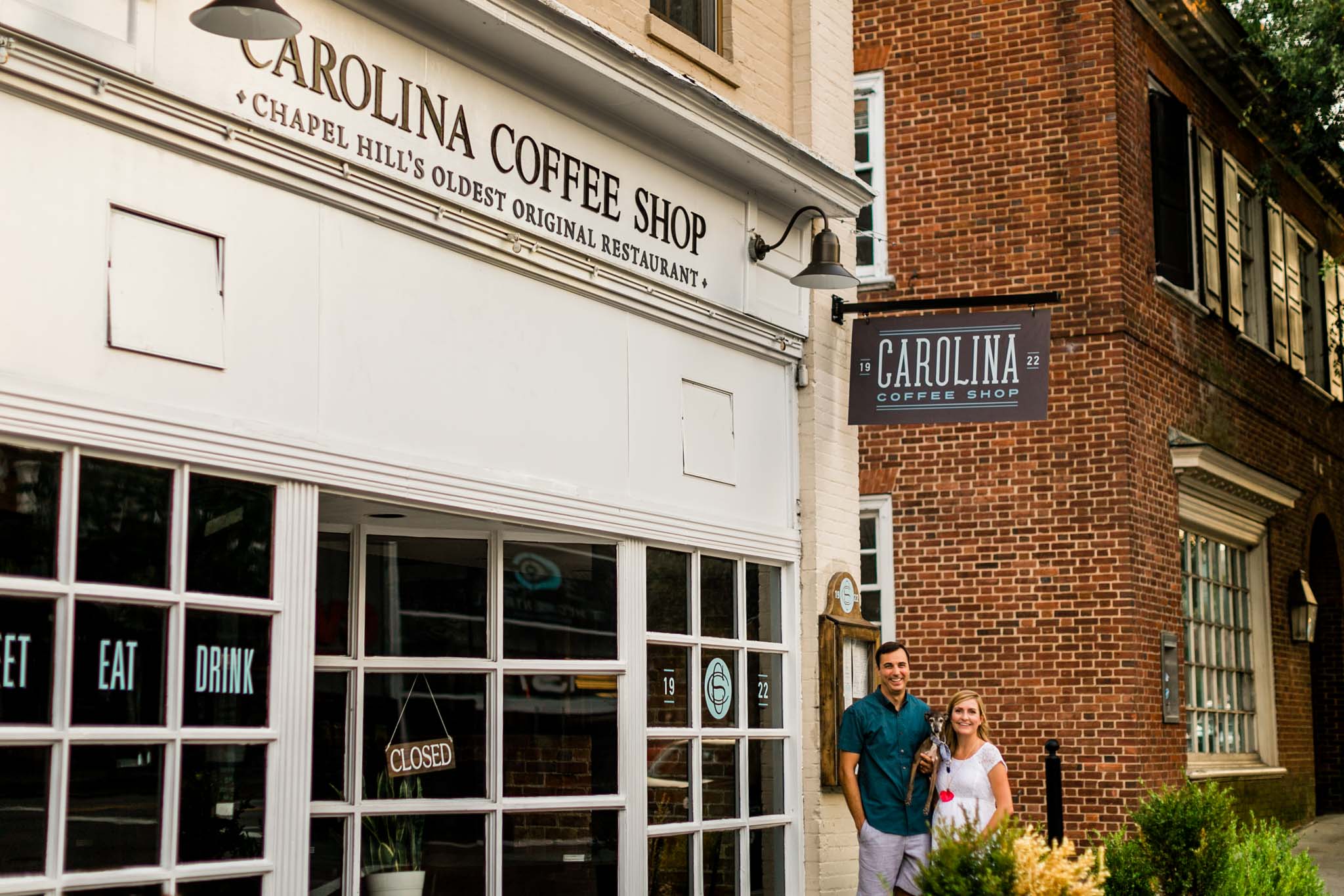 Couple standing in front of coffee shop at UNC | Chapel Hill Photographer | By G. Lin Photography