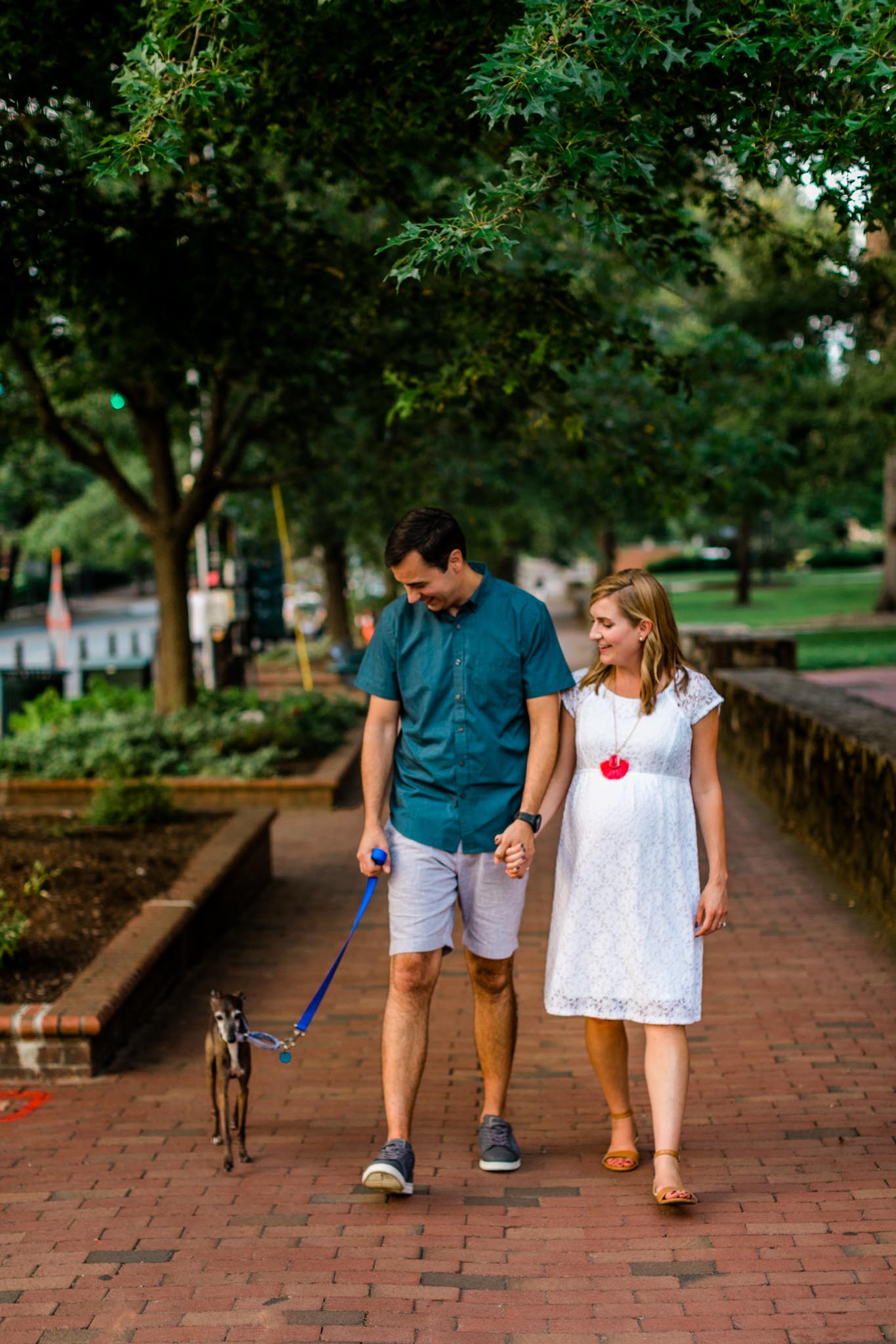 UNC Chapel Hill Photographer | By G. Lin Photography | Couple holding hands and walking down Franklin Street
