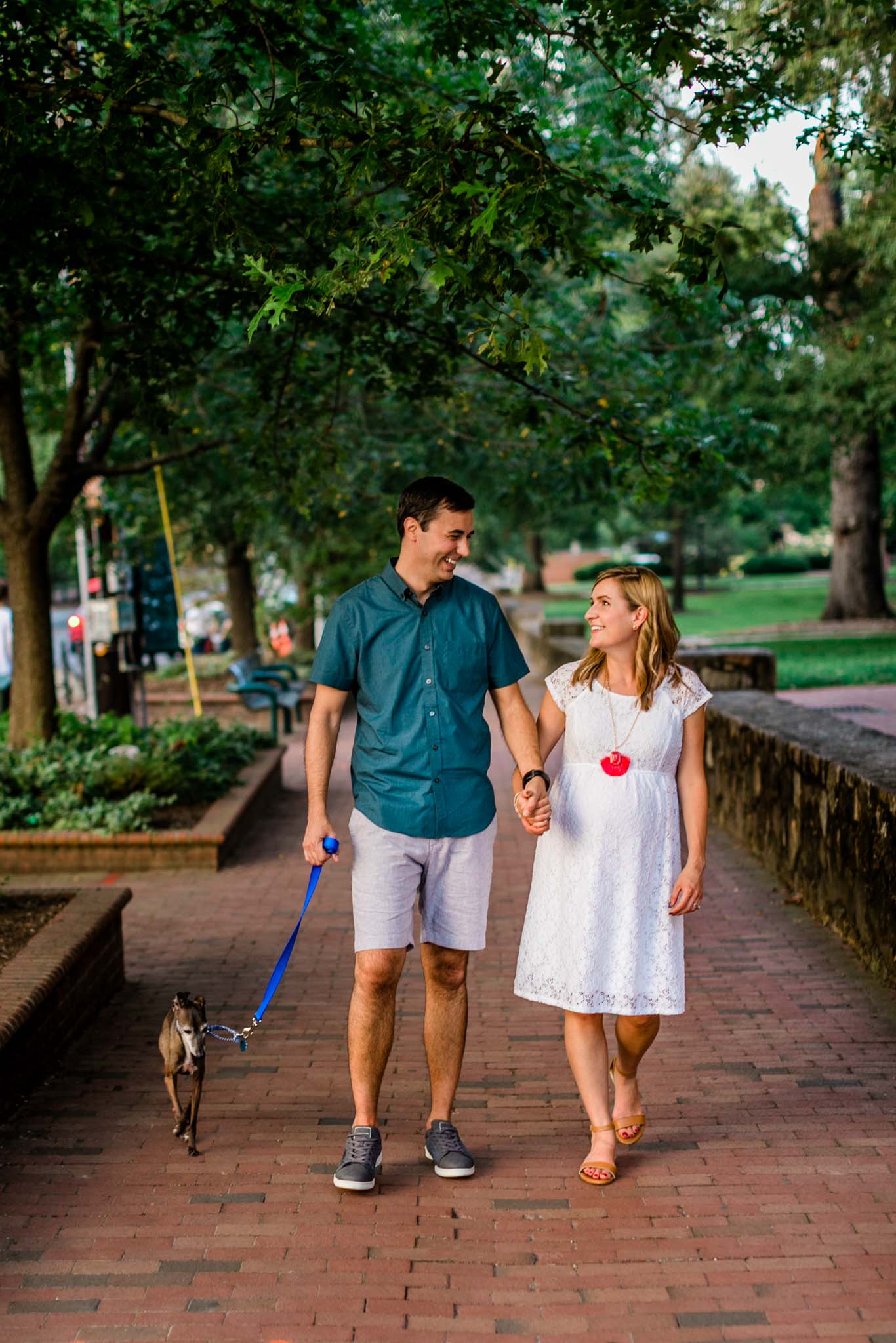 UNC Chapel Hill Photographer | By G. Lin Photography | Couple holding hands and walking down Franklin Street