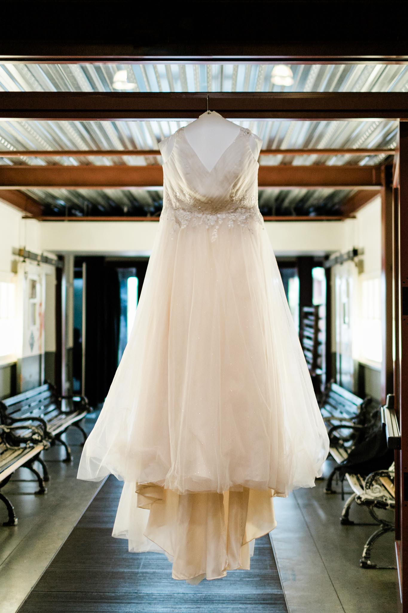 Haw River Ballroom Wedding | Durham Photographer | By G. Lin Photography | Wedding Dress hanging on doorway