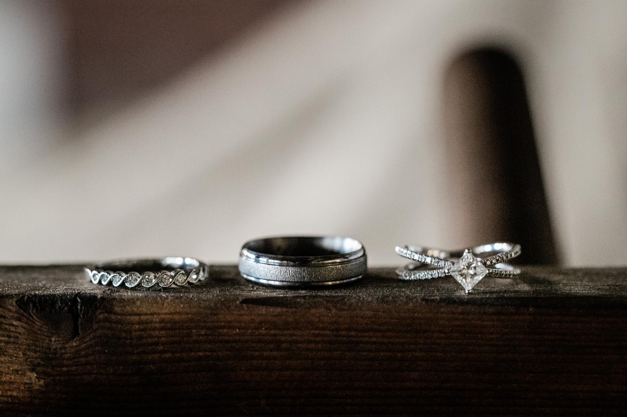 Haw River Ballroom Wedding | Durham Photographer | By G. Lin Photography | Wedding rings close up on wooden shelf