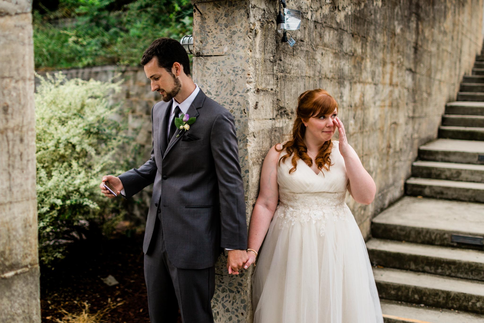 Haw River Ballroom Wedding | Durham Photographer | By G. Lin Photography | Couple praying together and holding hands before wedding