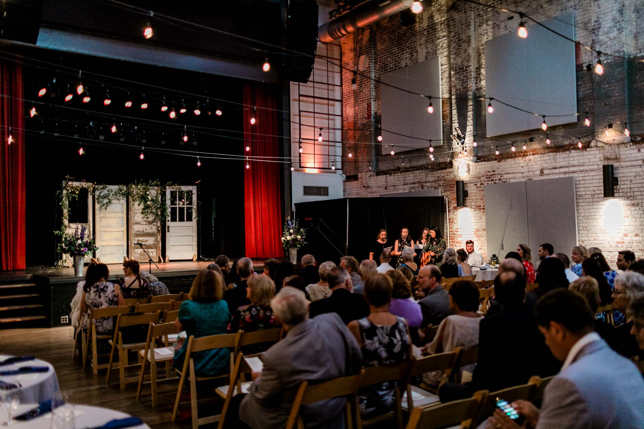 Haw River Ballroom Wedding | Durham Photographer | By G. Lin Photography | Guests seated and waiting for ceremony to start