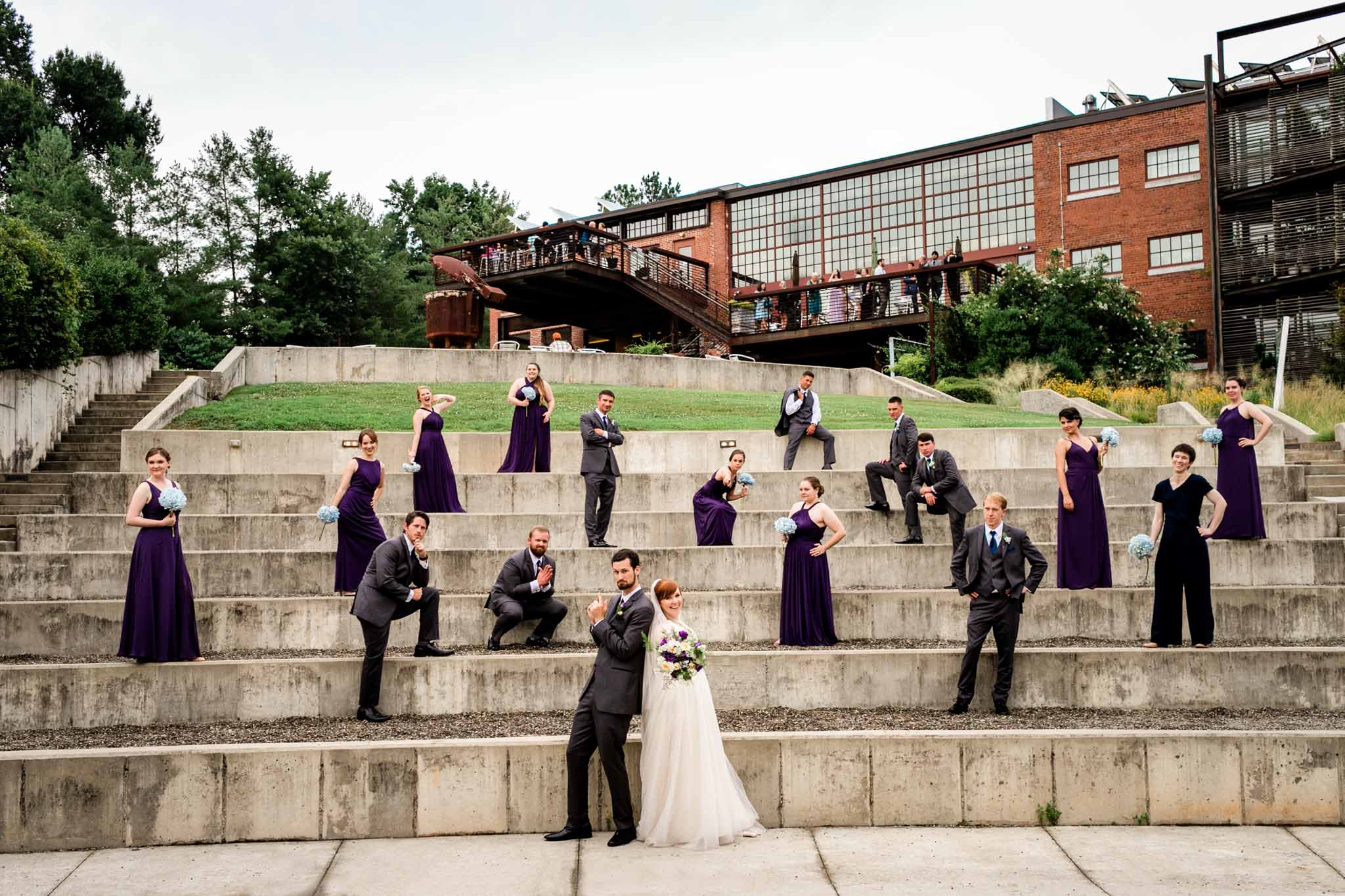 Haw River Ballroom Wedding | Durham Photographer | By G. Lin Photography | Wedding party posing outside at amphitheater