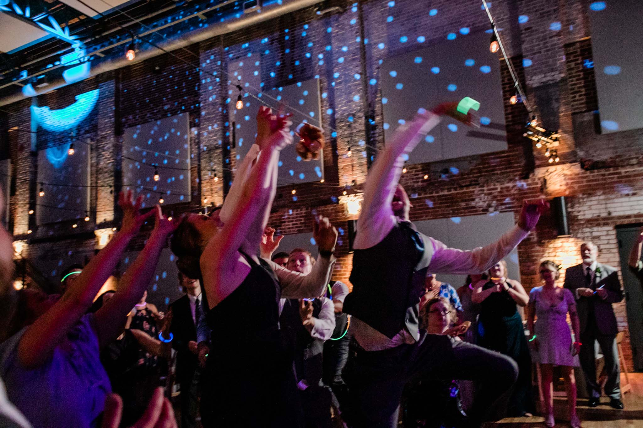 Haw River Ballroom Wedding | Durham Photographer | By G. Lin Photography | Wedding guests catching the teddy bear