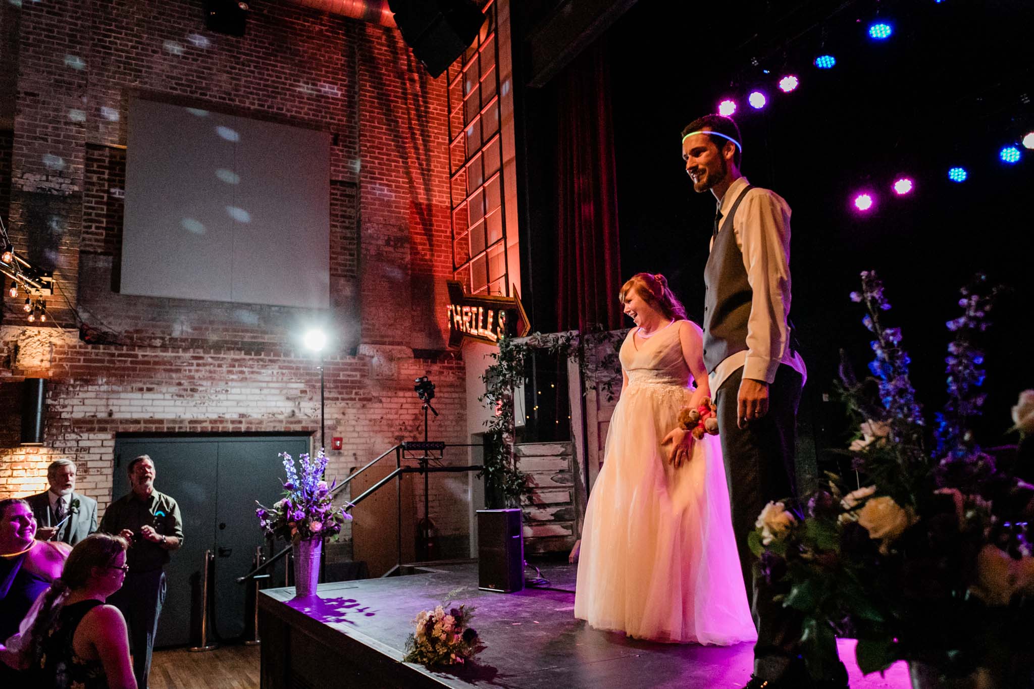 Haw River Ballroom Wedding | Durham Wedding Photographer | By G. Lin Photography | Bride and groom smiling at crowd