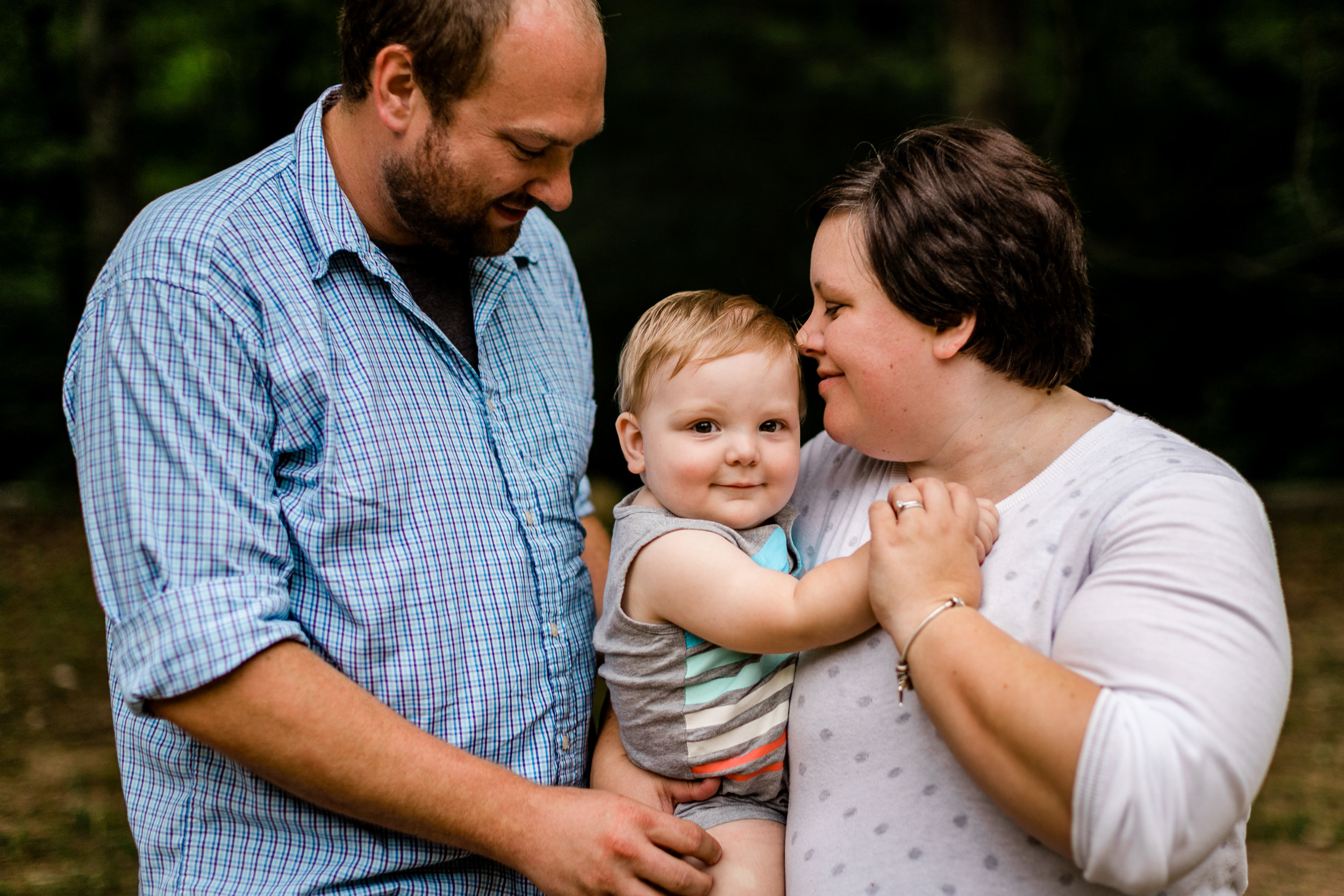 Durham Family Photographer | By G. Lin Photography | Parents holding son and holding hands