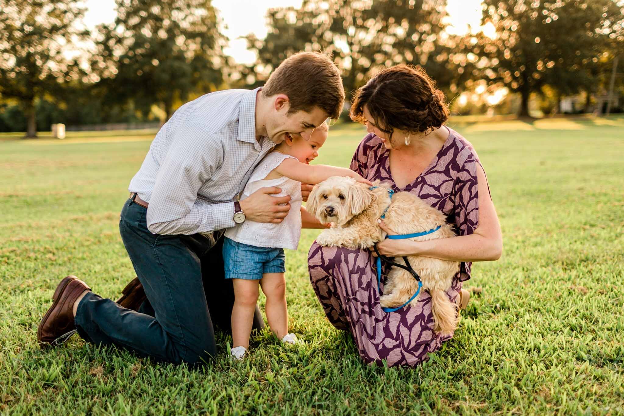 Family laughing together outside | Family Photography at Dix Park Raleigh | By G. Lin Photography