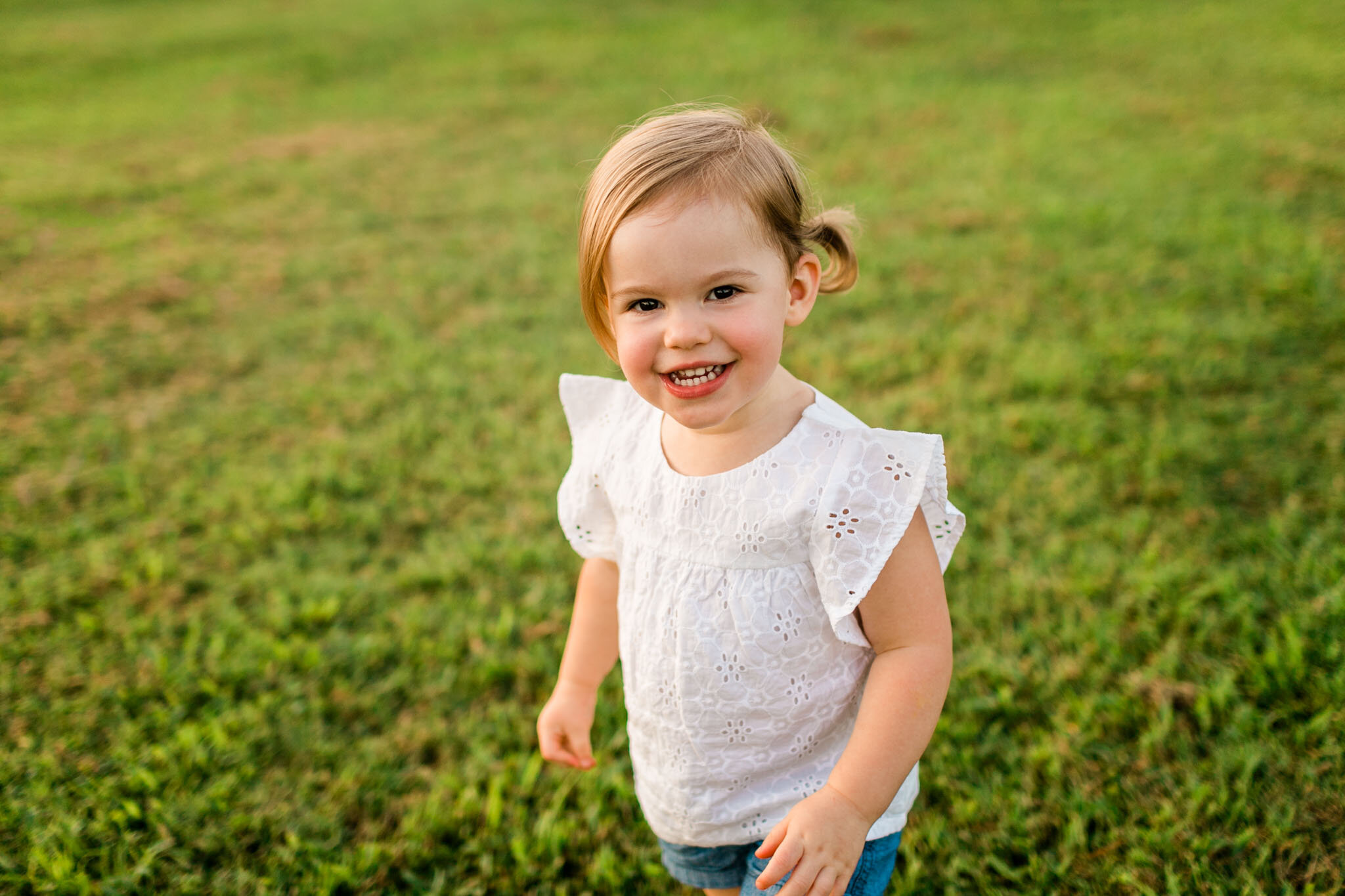 Raleigh Family Photographer | By G. Lin Photography | Dorothea Dix Park | Girl smiling at camera