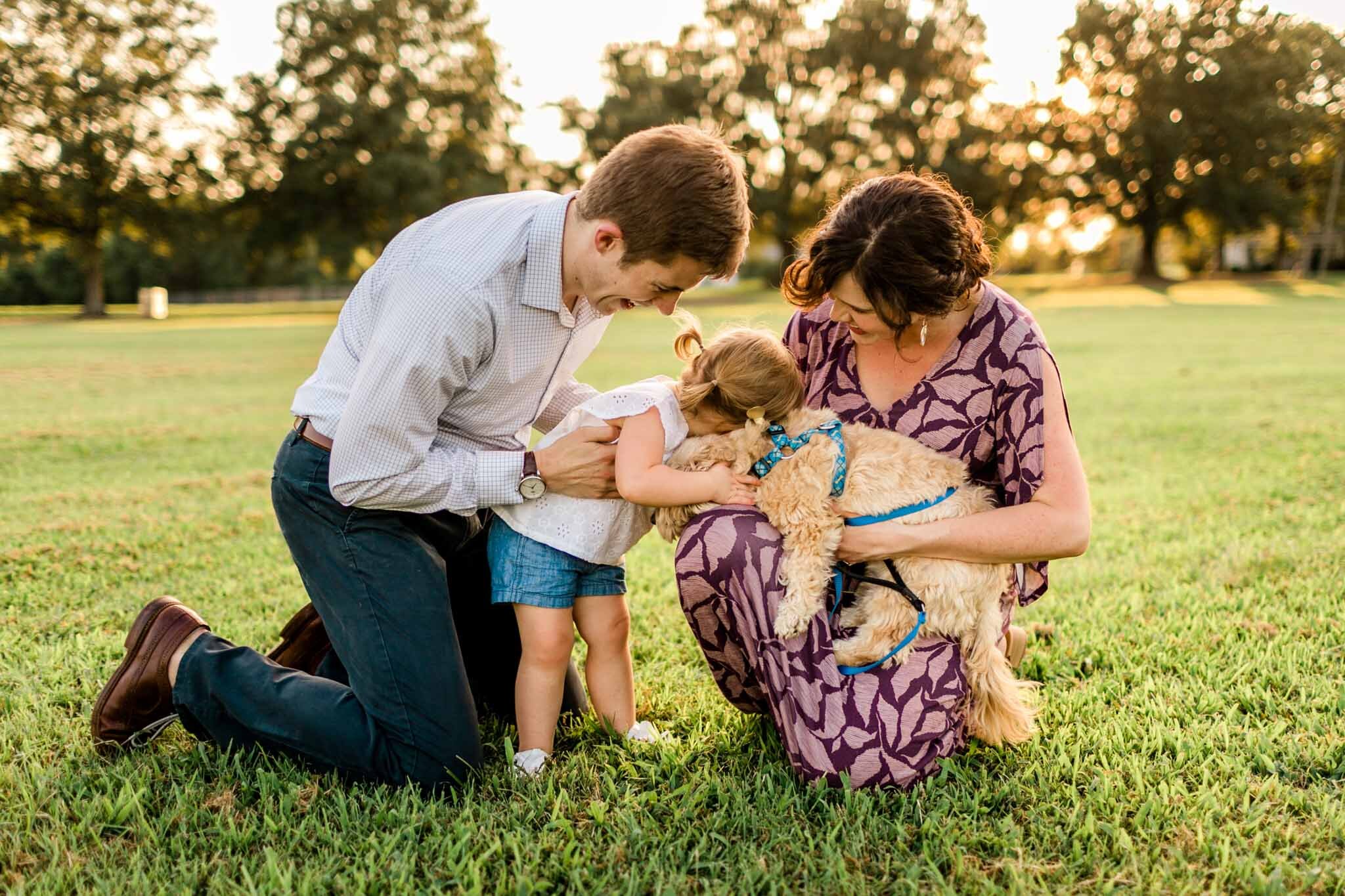 Family laughing together outside | Family Photography at Dix Park Raleigh | By G. Lin Photography
