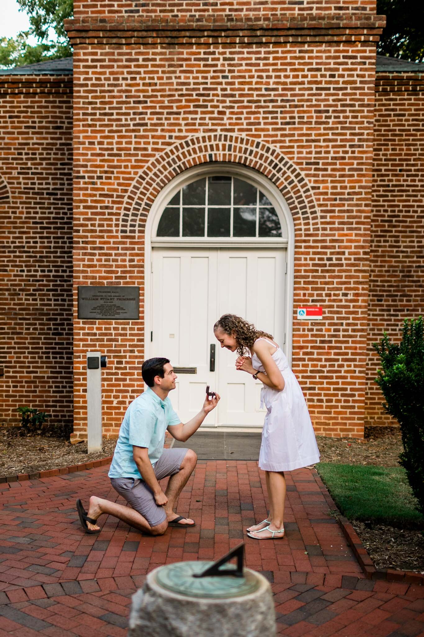 Raleigh Engagement Photographer | NC State University | By G. Lin Photography | Man offering engagement ring to woman
