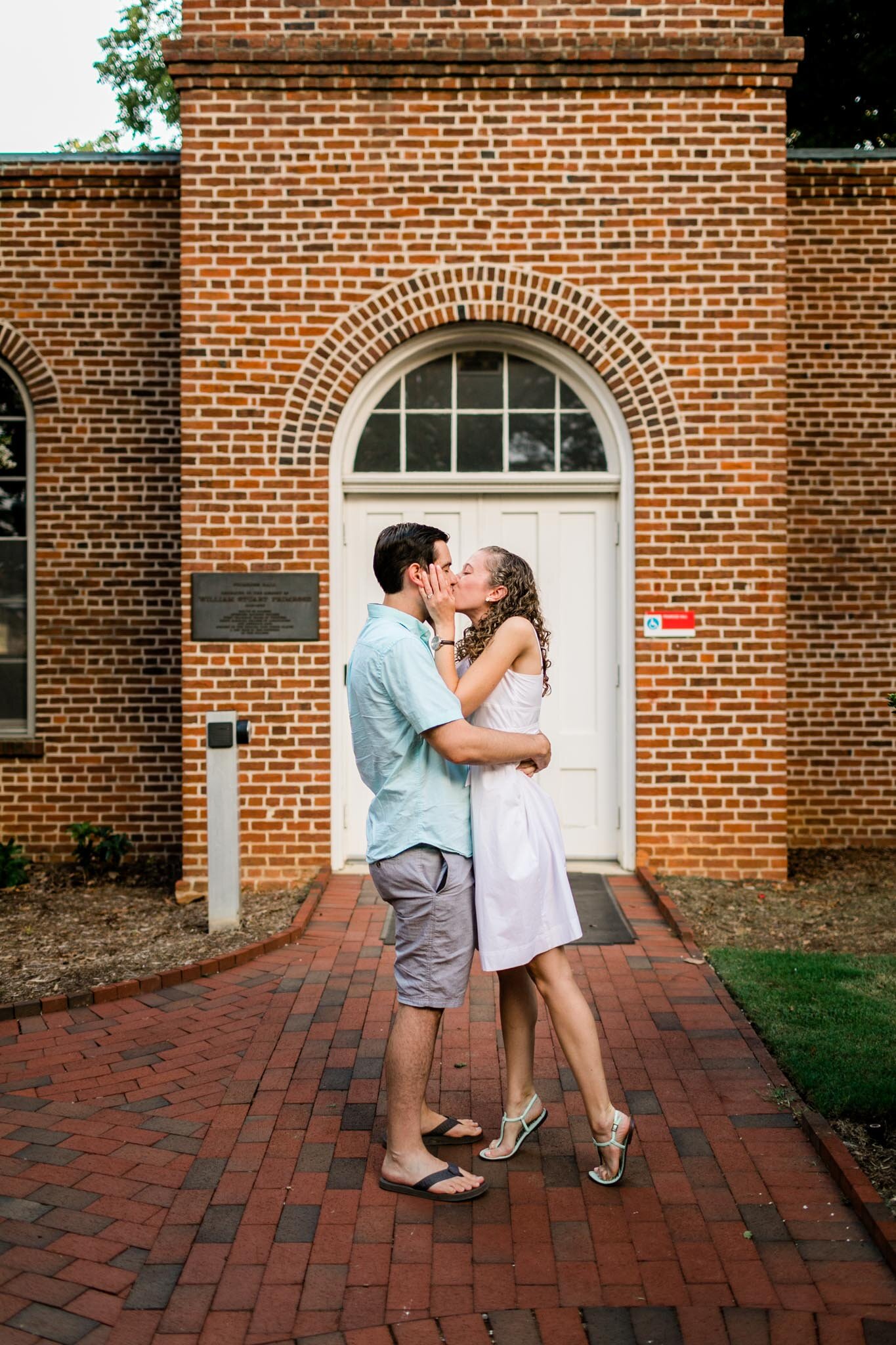 Raleigh Engagement Photographer | NC State University | By G. Lin Photography | Couple kissing after proposal
